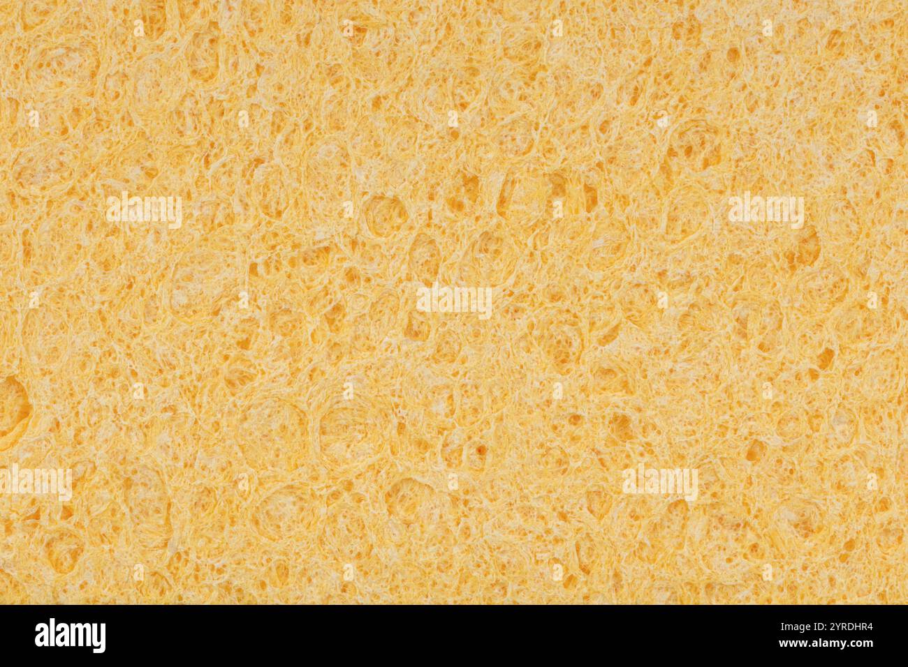 Makrotextur der gelben Schwammoberfläche Stockfoto