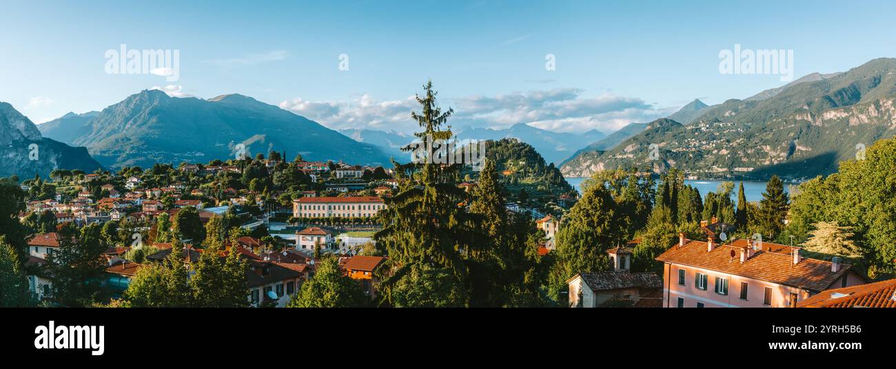 Warmes Sonnenlicht beleuchtet die farbenfrohen Gebäude und das üppige Grün von bellagio, italien. Der comer See und die grigne Berge schaffen eine malerische Atmosphäre Stockfoto