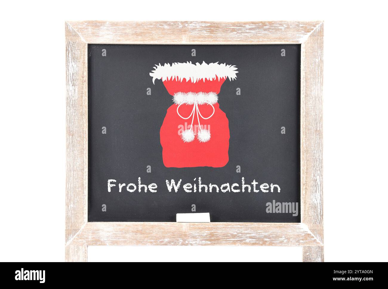 Weihnachtsgrüße mit dem Sack des Weihnachtsmanns an der Schultafel Stockfoto