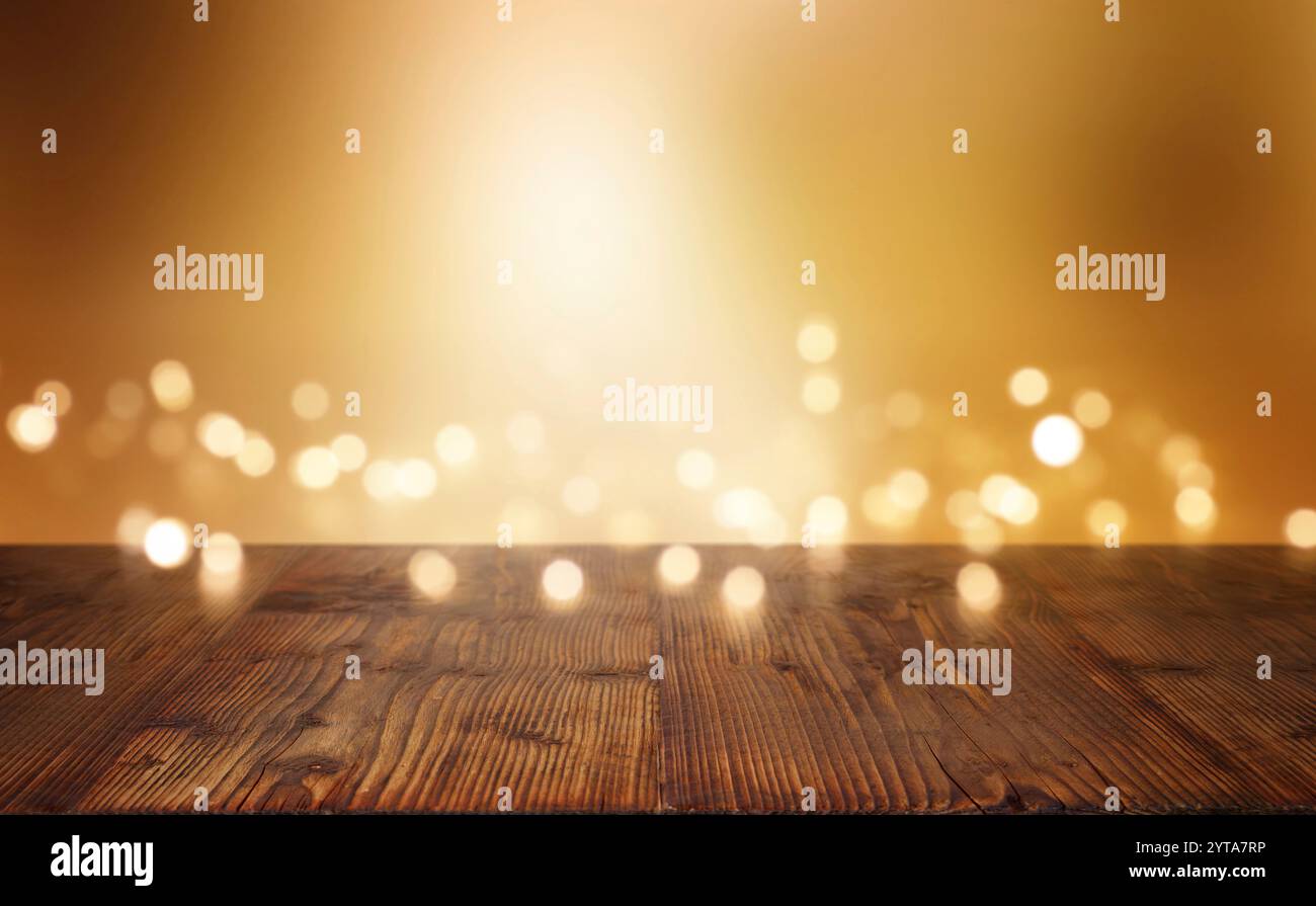 Festlich beleuchteten Hintergrund für Weihnachten vor einem Holztisch Stockfoto