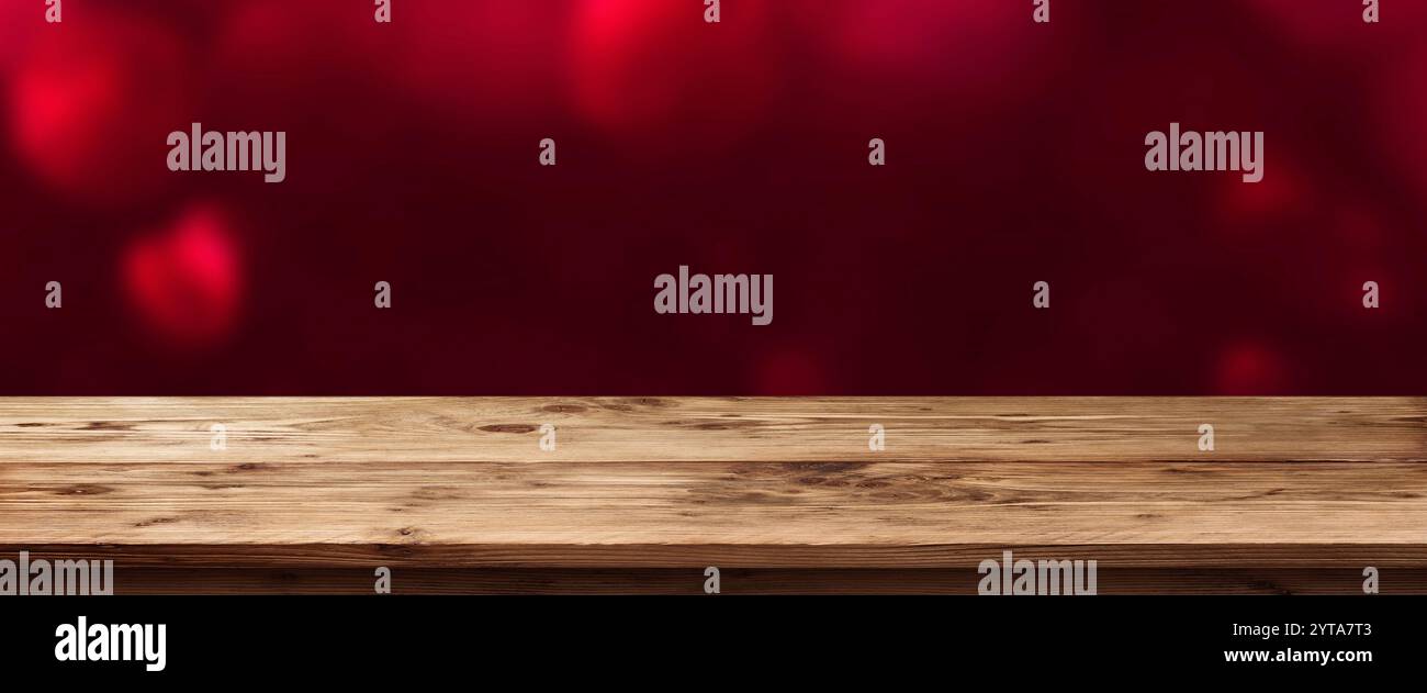 Valentine Hintergrund in Rot vor einem leeren Tisch Stockfoto