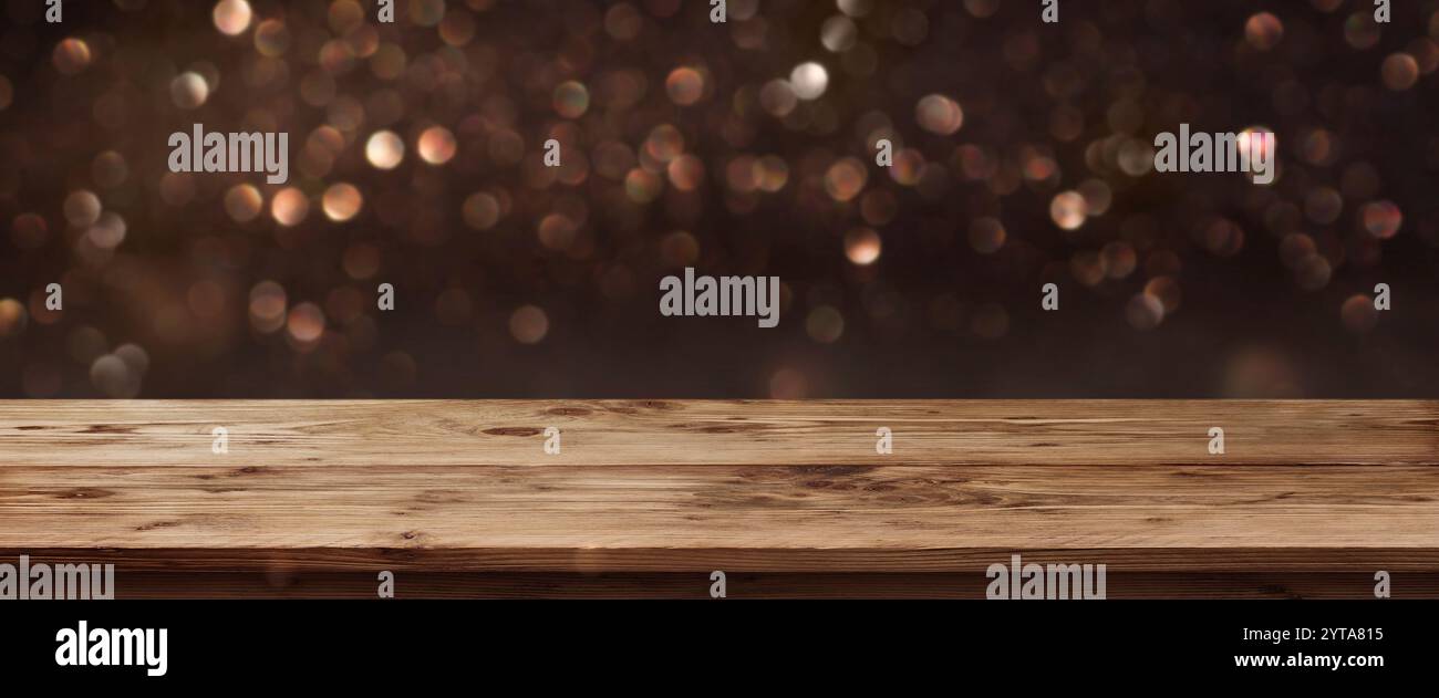 Gold schimmernden Panorama für die Feiertage vor einem Holztisch und ein Konzept Stockfoto