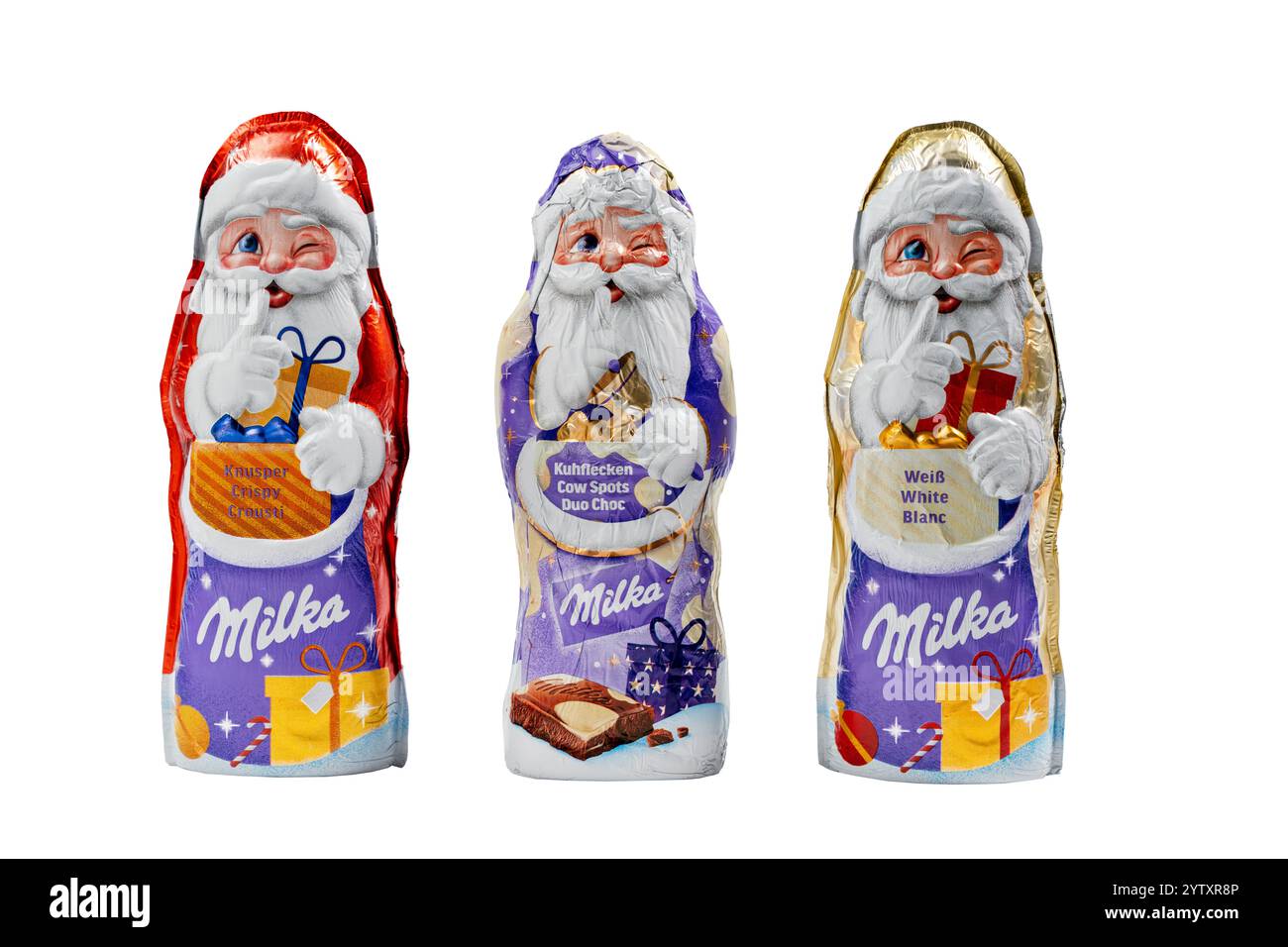 Deutschland Berlin 7. Dezember 2024. Drei Milka Schokoladenriegel mit Weihnachtsmann auf der Verpackung. Die Schokoladentafeln sind violett und Gold Stockfoto