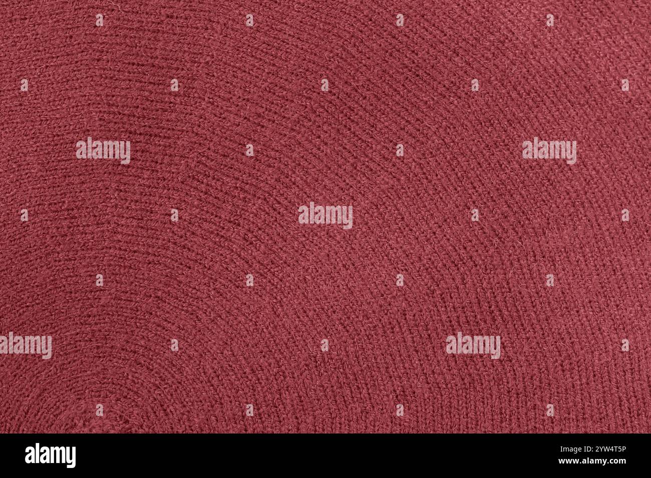 Kastanienbraunes Strickgewebe, Textur als Hintergrund, trendige Farbe Stockfoto