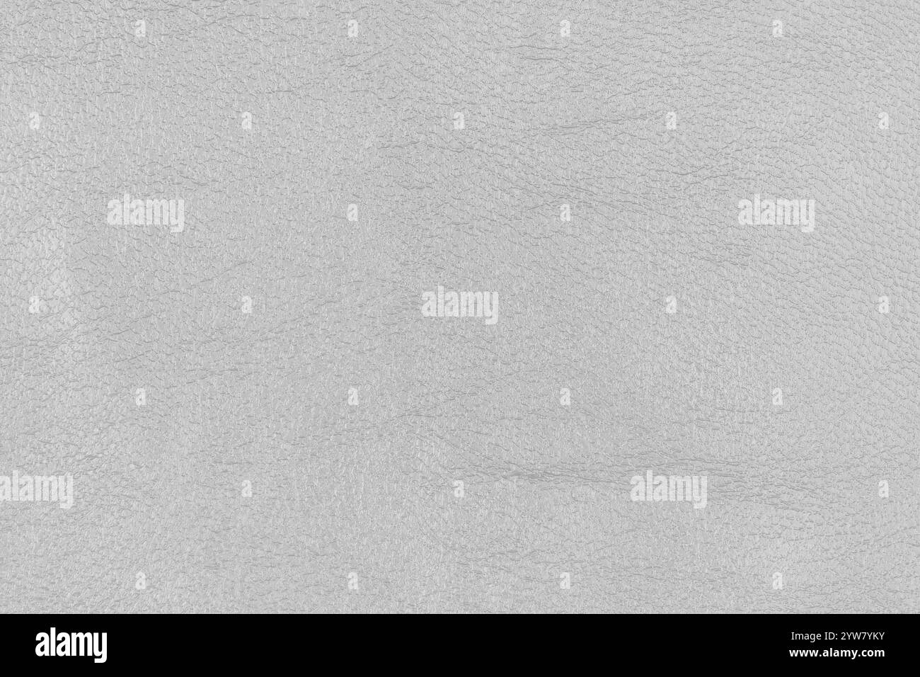 Hellgraues abstraktes Kunstledermuster als Designelement. Nahaufnahme von Kunstleder mit schattiger weißer Farbe auf oberflächennaher Ebene Stockfoto