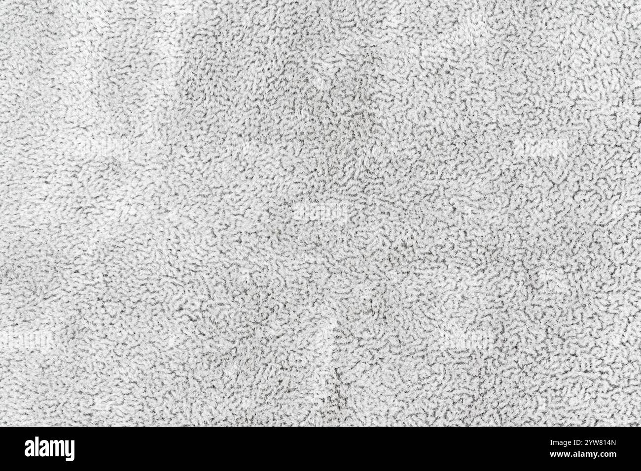 Graues Stofftuch mit kurzem flauschigem und weichem Hintergrund mit abstrakter Textur. Makrofotografie mit Nahaufnahme von oben auf dunkelweißem Oberstoff Stockfoto