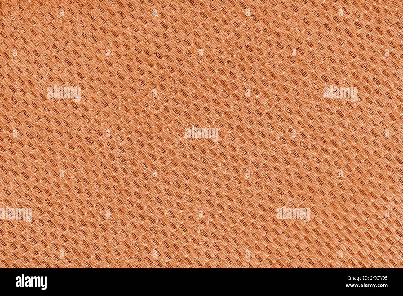 Textur des orangen Jacquard-Gewebes aus diagonalem Grobgeweben-Makro, Nahaufnahme. Material für Heimtextilien, Polster und Vorhangdekor, Bekleidung. Hintergrund Stockfoto