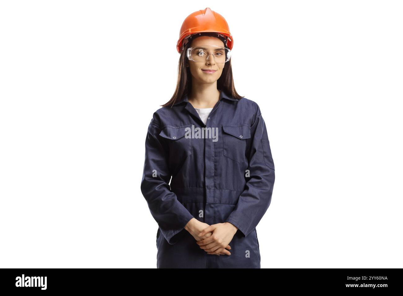 Junge Arbeiterin Uniform mit Helm und Schutzbrille isoliert auf weißem Hintergrund Stockfoto