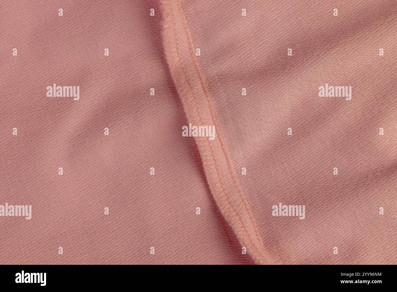 Wunderschöner rosafarbener Baumwollstoff, Details eines Teils des rosafarbenen Stoffes, der zur Herstellung von Kleidung verwendet wird Stockfoto