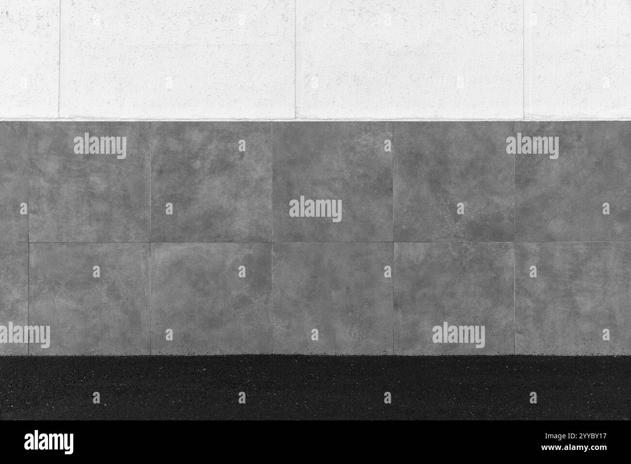 Städtischer Hintergrund mit grauer weißer Steinmauer und schwarzem Asphaltboden Stockfoto Städtischer Hintergrund mit grauer weißer Steinmauer und schwarzem Asphaltboden Stockfoto
