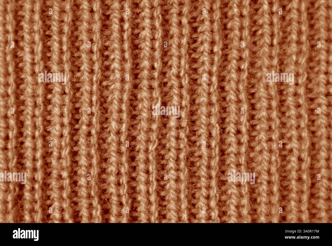 Die Textur aus gestricktem Wollgewebe mit Mokakomusse in vertikalen Mustern Stockfoto