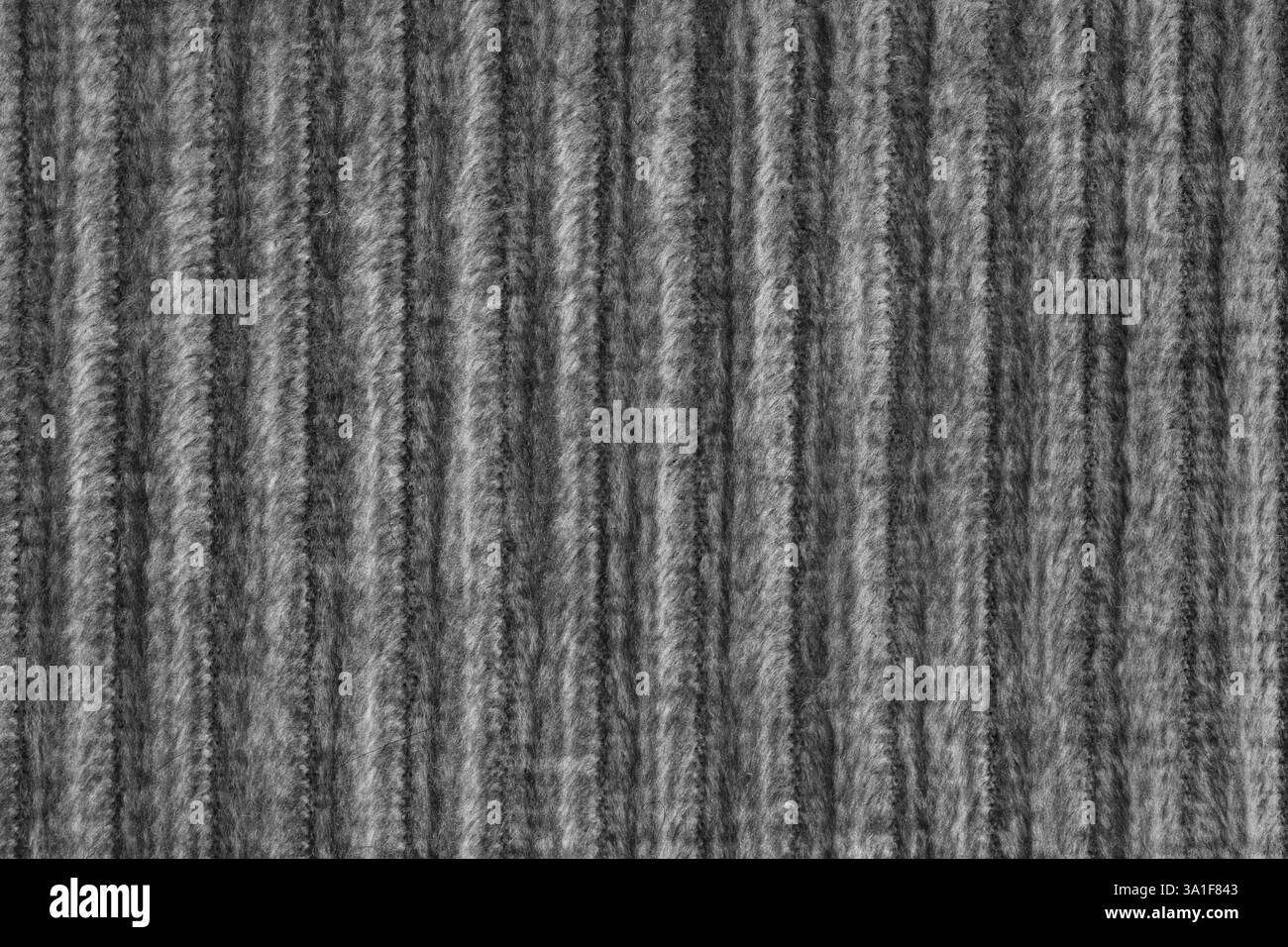 Ridge-Makrostruktur aus schwarzem Velours-Cordtuch. Große gerippte, grobe Websamtgewebe, gestreifte Polsterung Textur Stoff Hintergrund, Möbel te Stockfoto