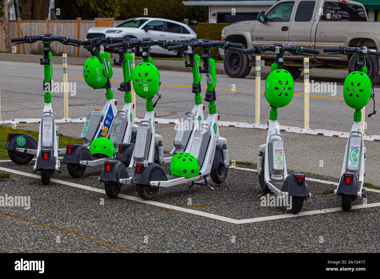 Leihroller, die in einer ausgewiesenen Absetzzone in Steveston B.C. Kanada geparkt sind Stockfoto