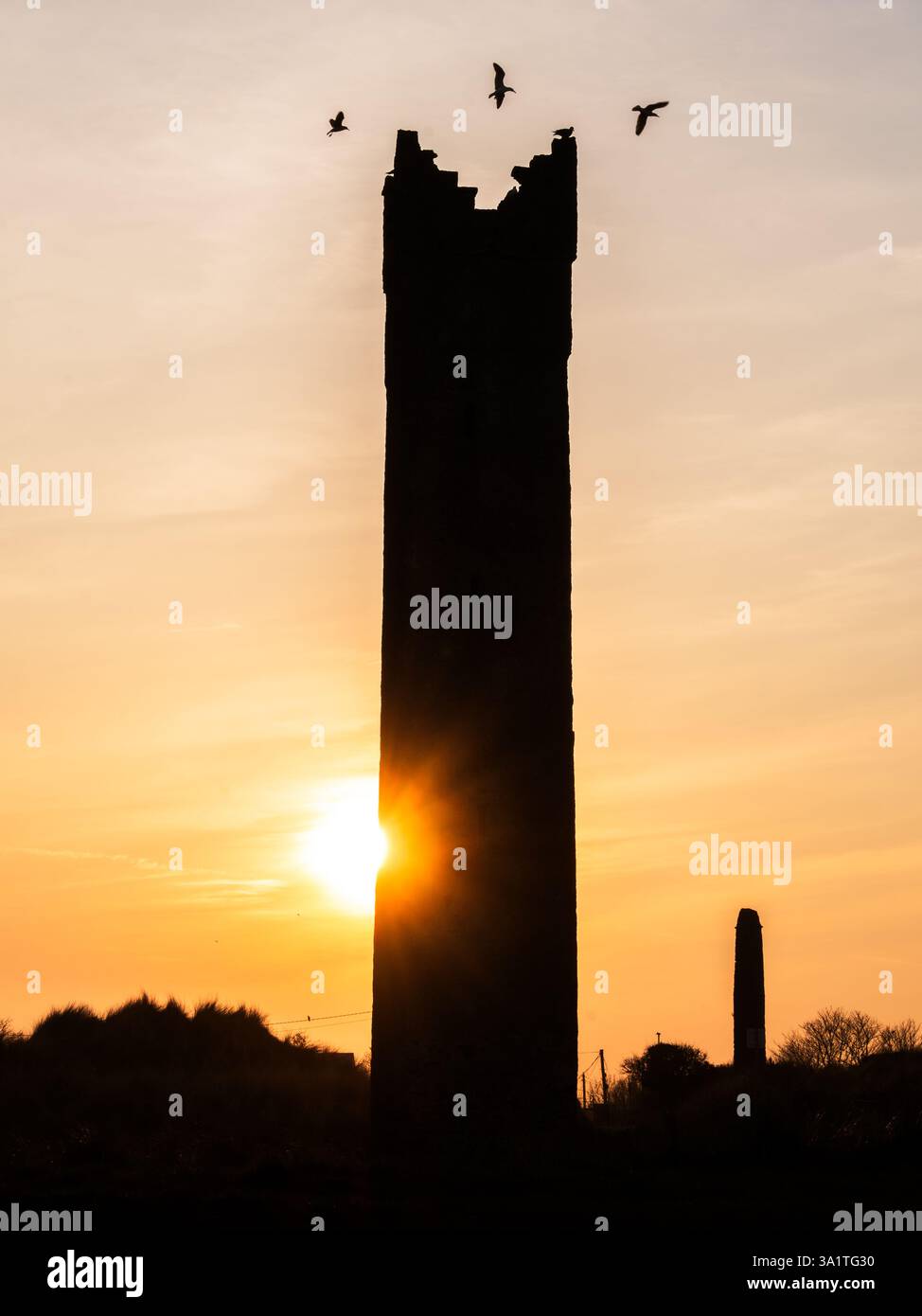 Sonnenuntergang über Mornington Maiden Tower und Strand Stockfoto