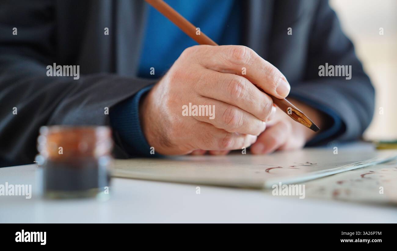 Die Kunst des Schreibens der Kalligraphie Stockfoto