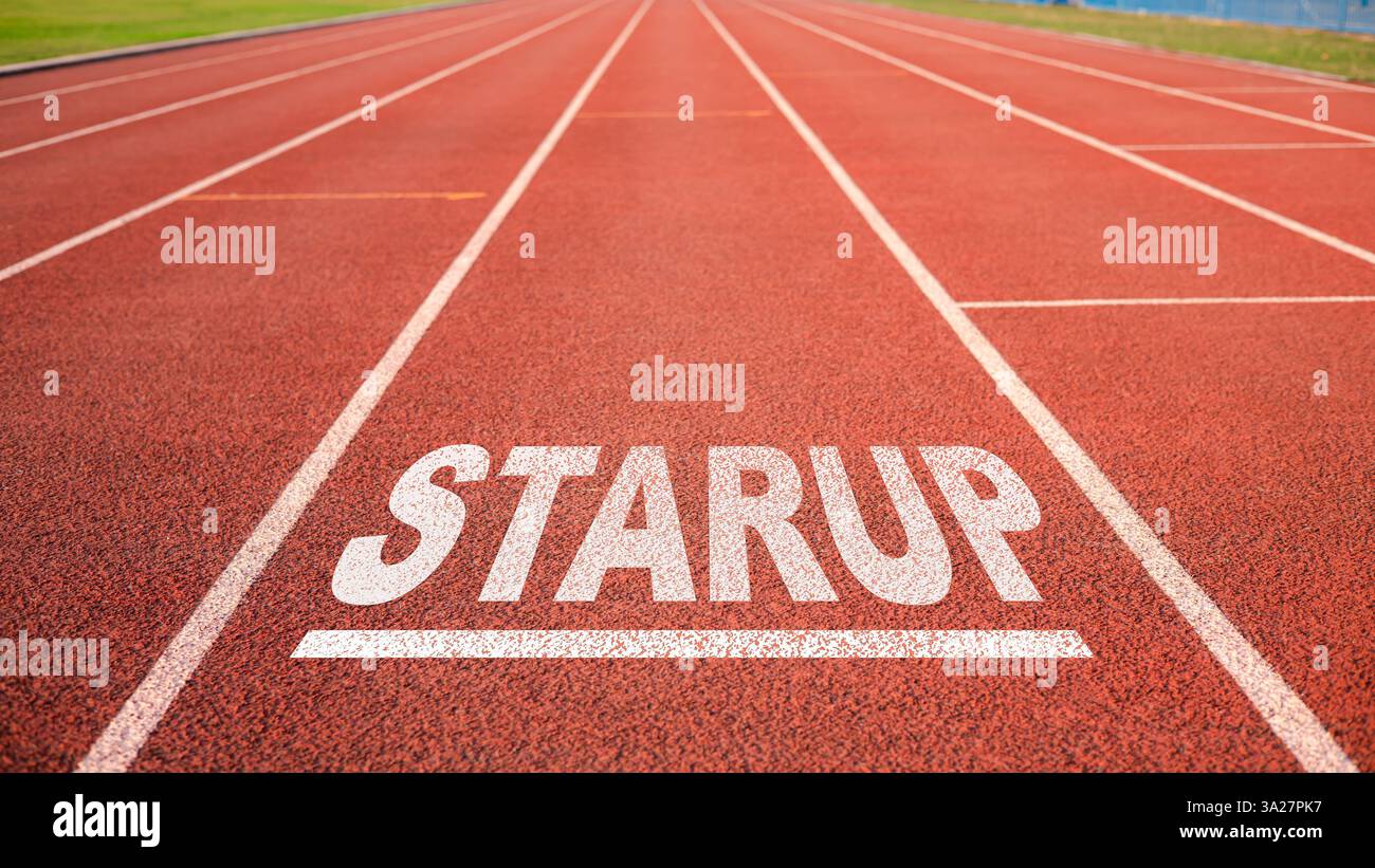 Startup Business Concept, auf der Start Line auf der Laufbahn im Arena Stadium präsent, Startup auf der Laufbahn geschrieben, heißt es auf dem Laufband entlang des Stadions Stockfoto
