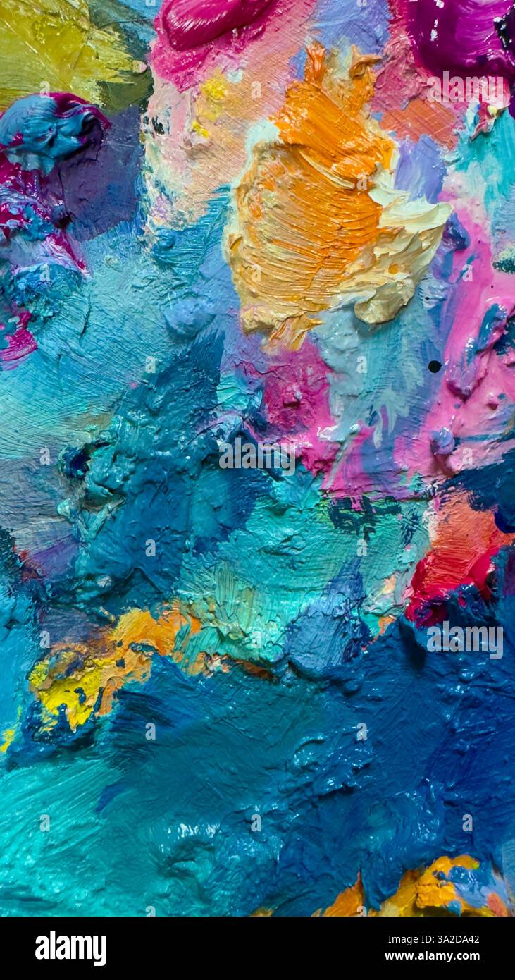 Hintergrund der hellen Ölfarben-Palette Nahaufnahmemuster, blau, gelb, rosa Textur. Stockfoto
