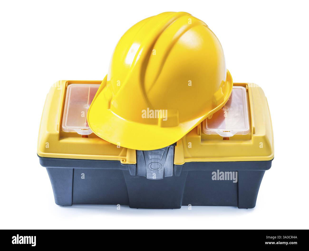 Gelber Helm am Werkzeugkasten isoliert weiß Stockfoto