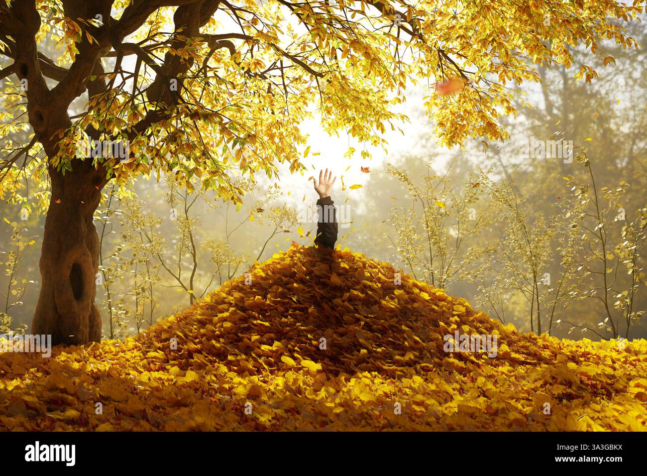 Die männliche Hand kommt aus dem Blätterhaufen. Konzept Herbstspaß Stockfoto