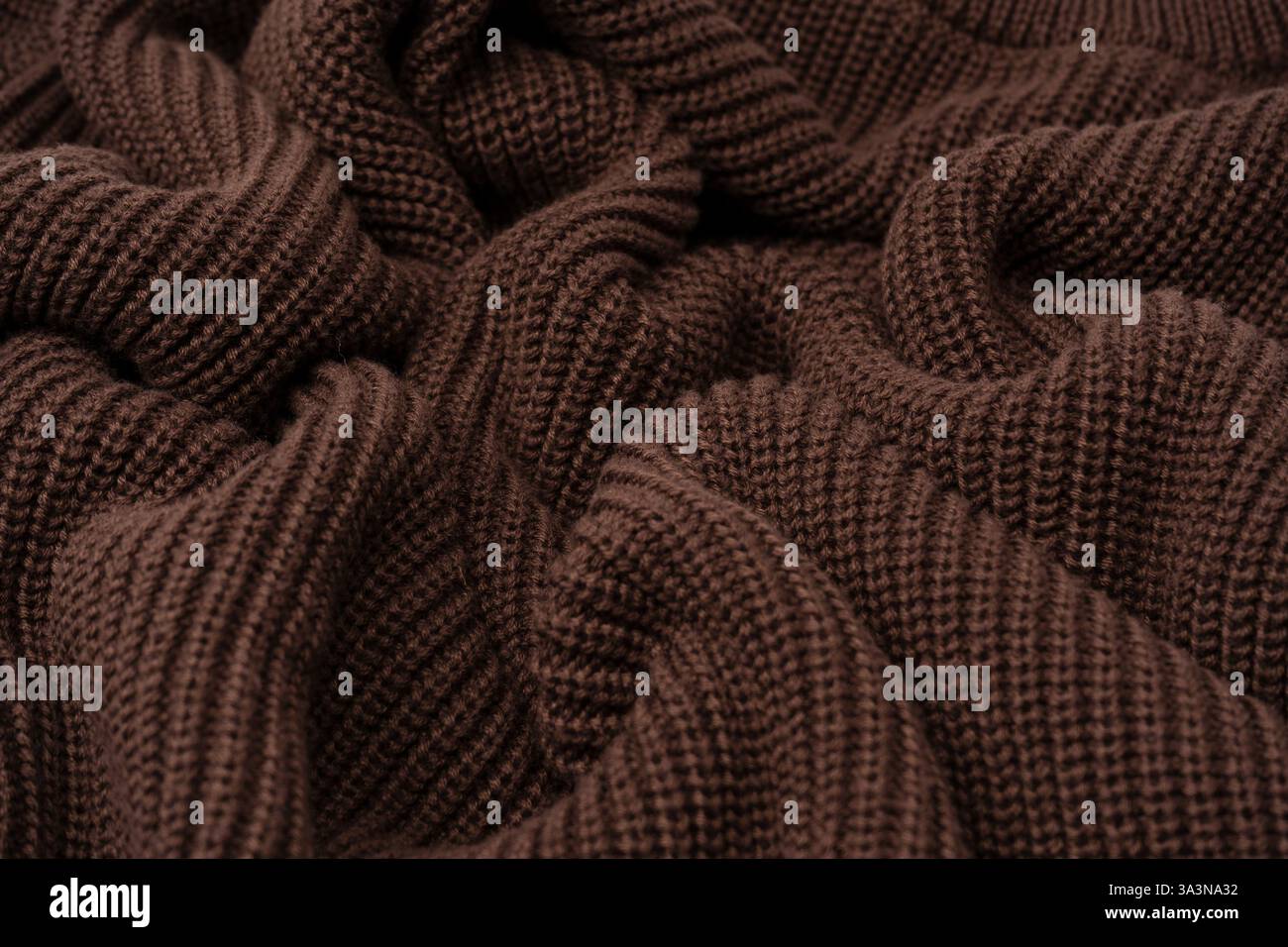 Braune Pullover-Textur als Hintergrund. Draufsicht. Stockfoto