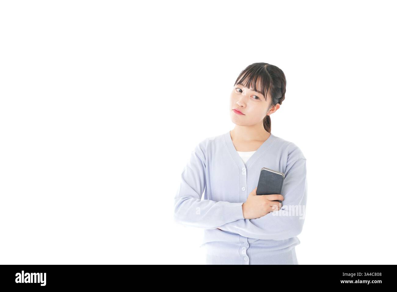 Junge Studentin mit Smartphone Stockfoto