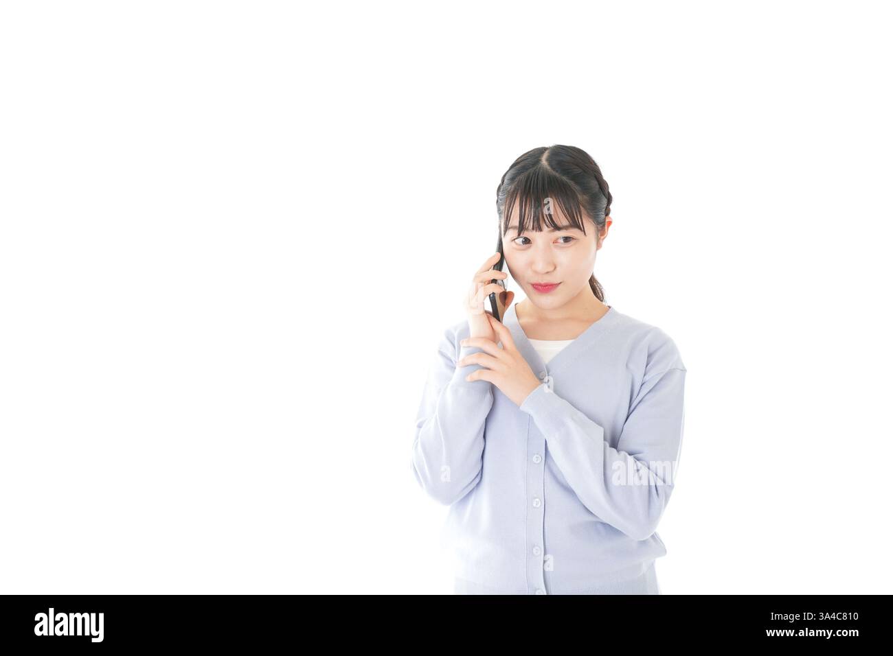 Junge Studentin mit Smartphone Stockfoto