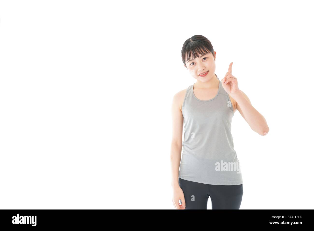 Junge Frau in Sportbekleidung, die Ratschläge gibt Stockfoto