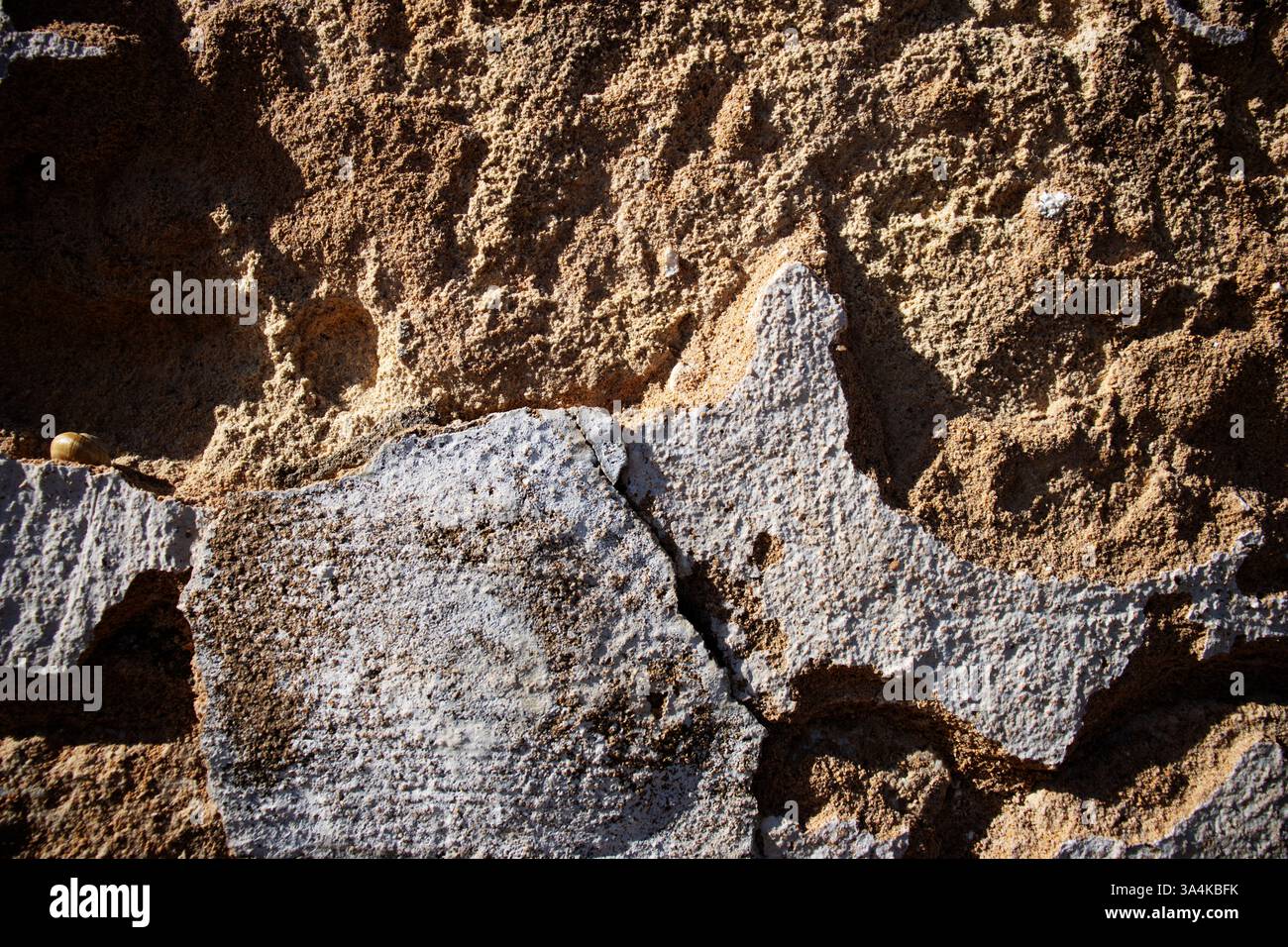 Detail der verwitterten Steinzementwand Stockfoto