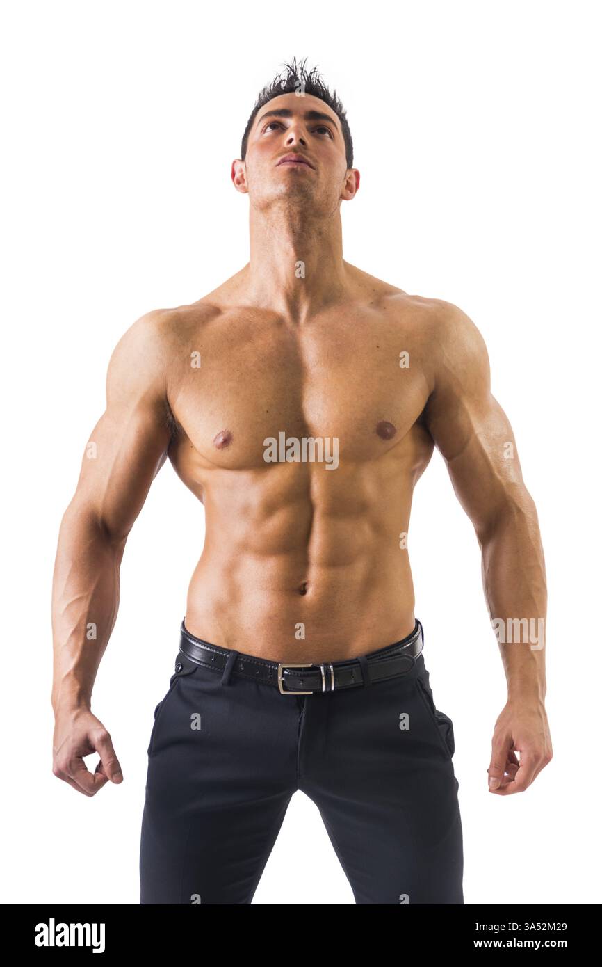 Gutaussehender Power-Athletic-Typ, der nach oben blickt, isoliert in weißem Hintergrund Stockfoto