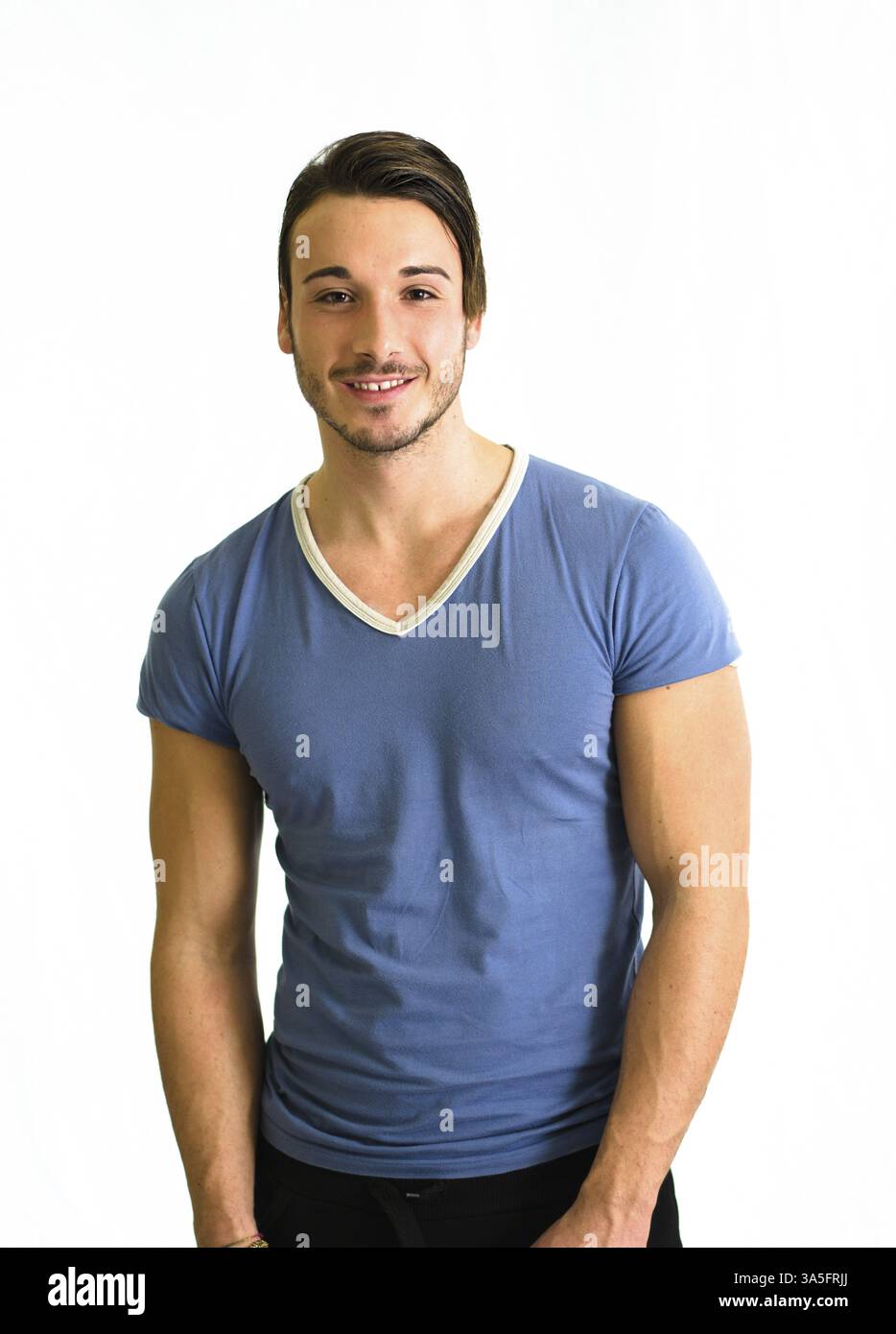 Lächelnd und netten jungen Mann, muskulös, isoliert auf weißem Hintergrund Stockfoto