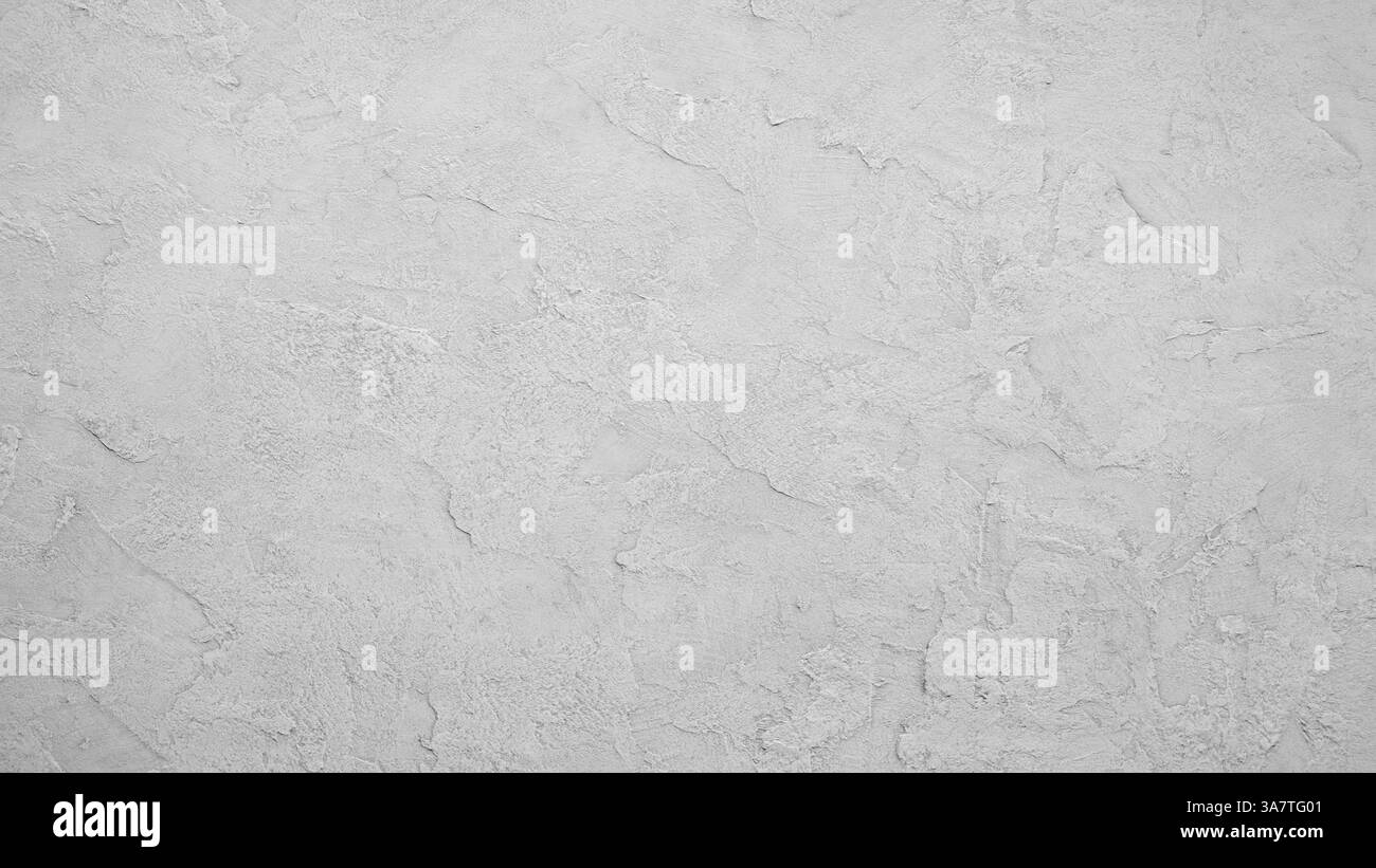 Eine weiße Wand mit grauer Textur. Die Wand ist glatt und hat eine etwas raue Textur. Die Wand ist eine leere Leinwand, die zum Bemalen oder Dekorieren bereit ist Stockfoto