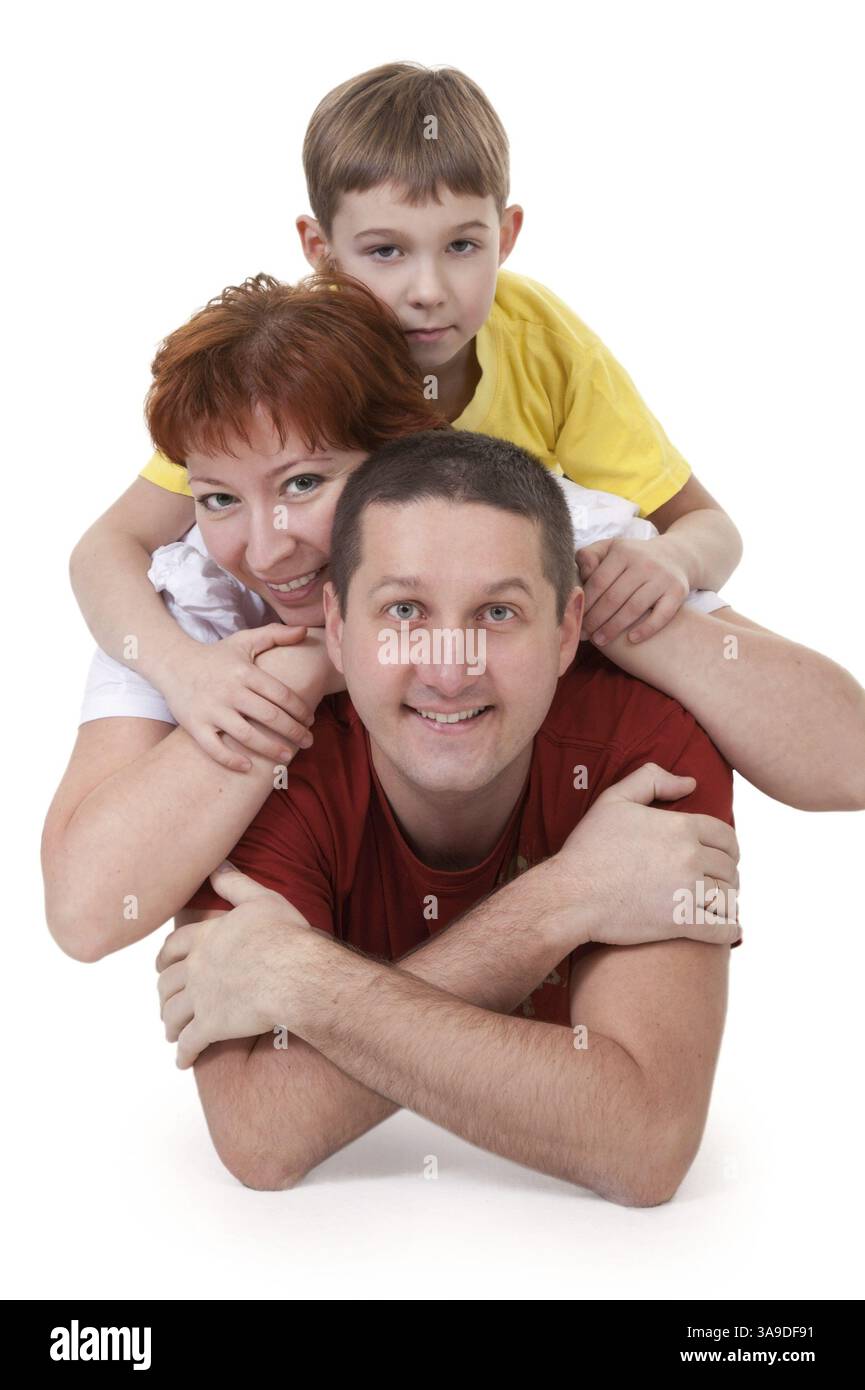 Mama und Papa und Sohn auf einem weißen Hintergrund liegend Stockfoto