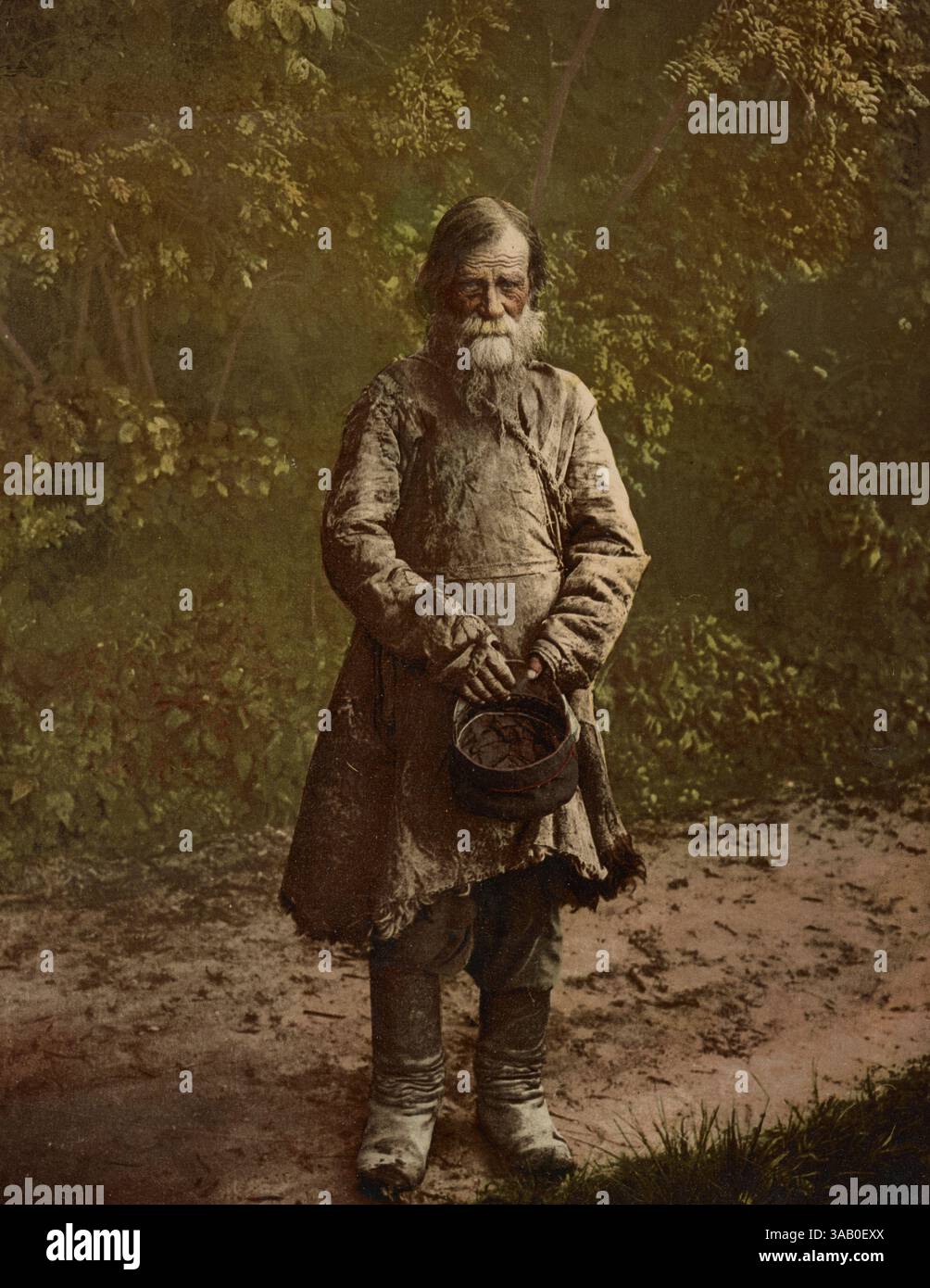 Vintage-Fotochrom-Druck eines russischen Bettlers. Stockfoto