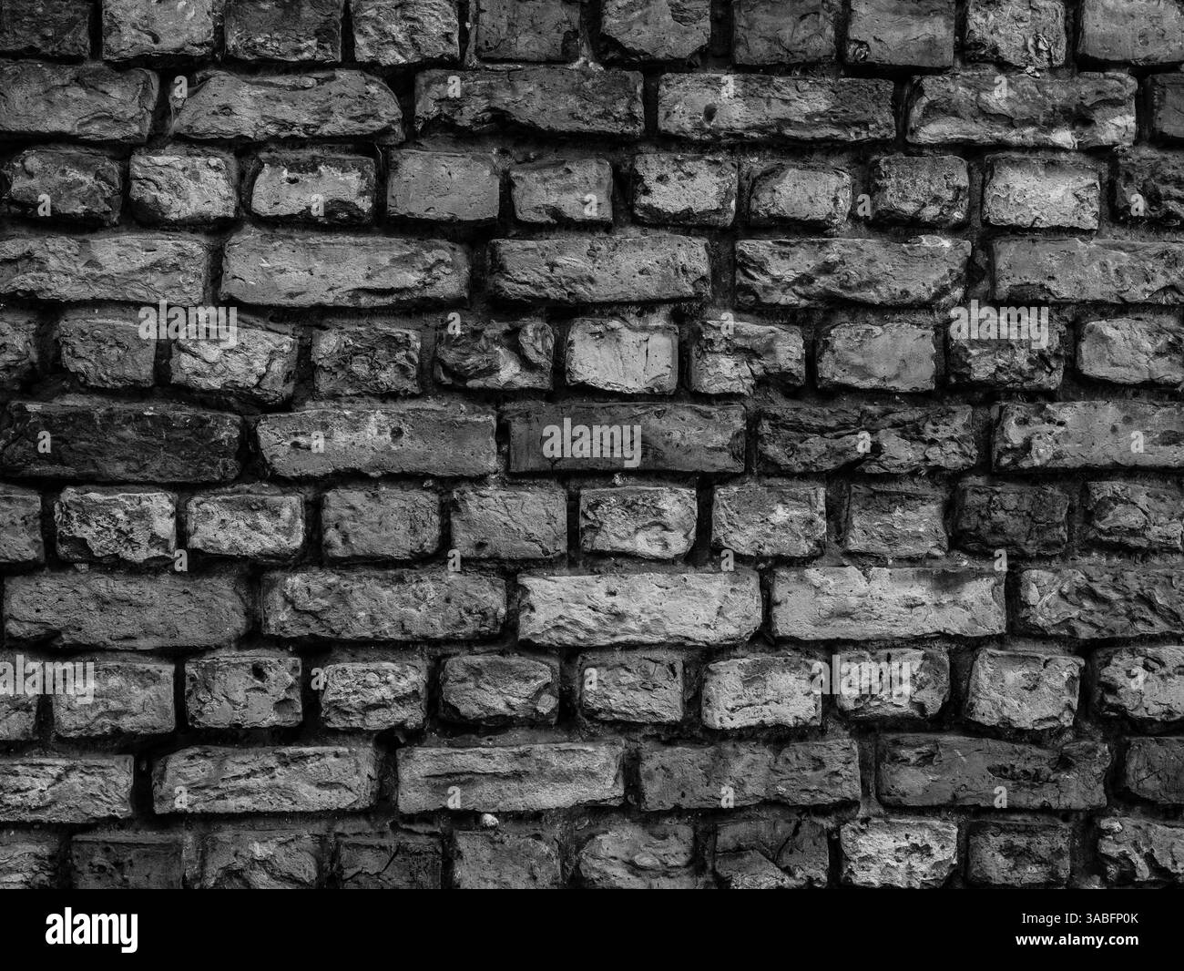 Alte Backsteinwand Hintergrund schwarz-weiß Stockfoto