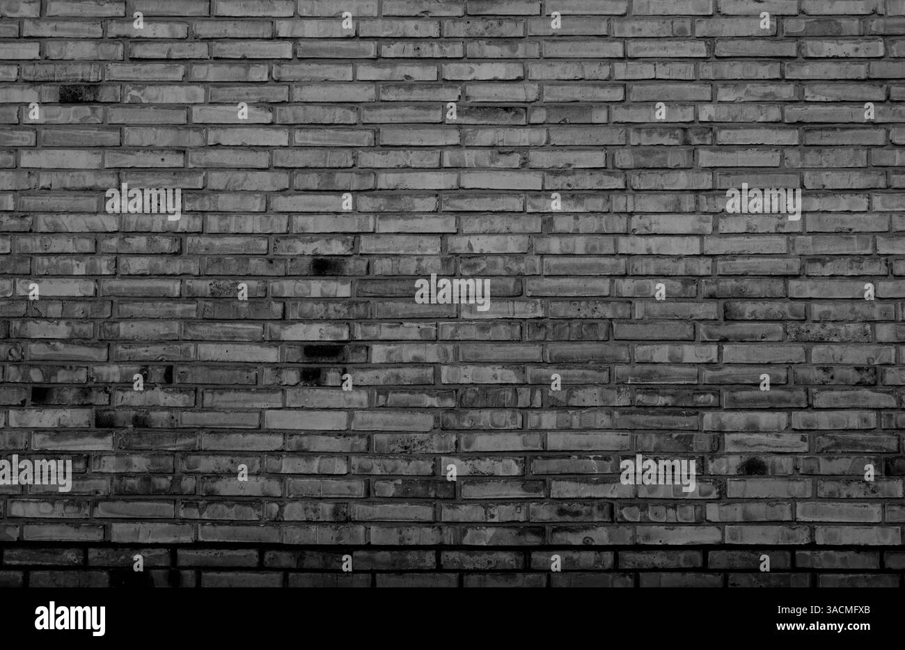 Cooler rustikaler Hintergrund einer alten unebenen Ziegelmauer mit Retro-Look Stockfoto