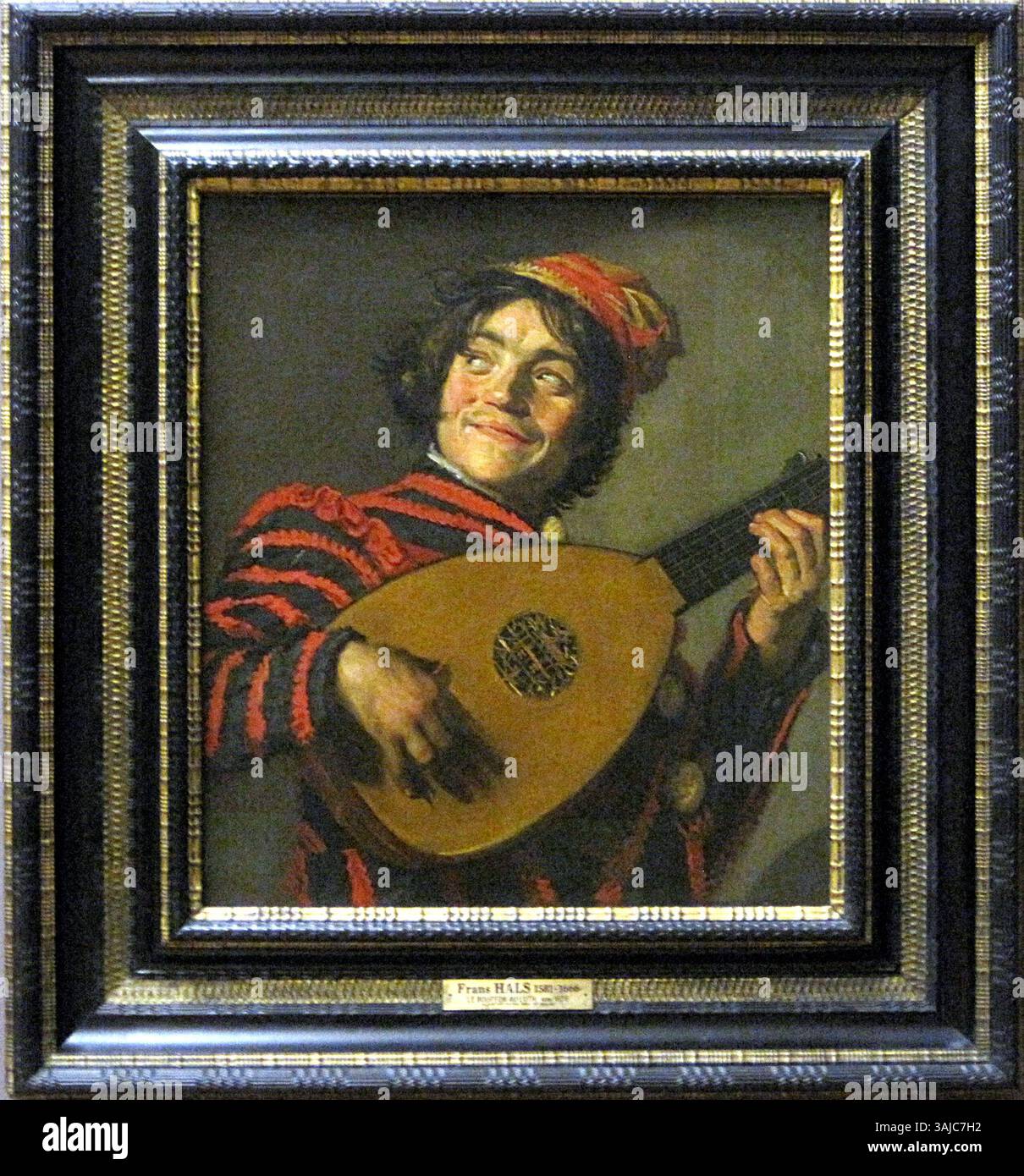 Frans Hals’ Gemälde „der Lautenspieler“ aus dem Jahr 1623-1624 ist ein Meisterwerk des niederländischen Goldenen Zeitalters mit einem verspielten Porträt eines Narren mit einer Laute. Das Öl auf Leinwand befindet sich im Louvre, Paris. Stockfoto