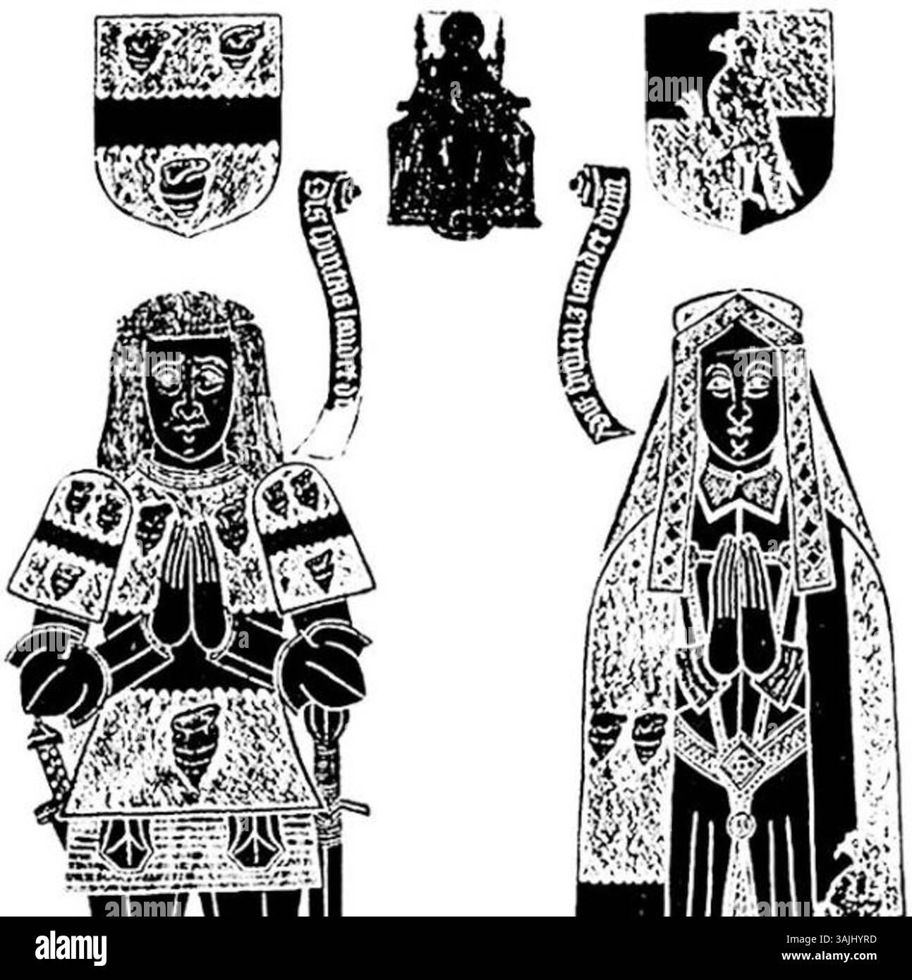 Das monumentale Messingdenkmal von Sir John Shelley und seiner Frau Elizabeth Michelgrove befindet sich auf dem Boden der St. Mary's Church in Clapham, Sussex. Dieses Messing aus dem Jahr 1526 zeigt ihre Wappen, eine detaillierte Darstellung von Sir John und seiner Frau in zeremonieller Kleidung, die ihr Vermächtnis in der Pfarrei Clapham markiert. Stockfoto