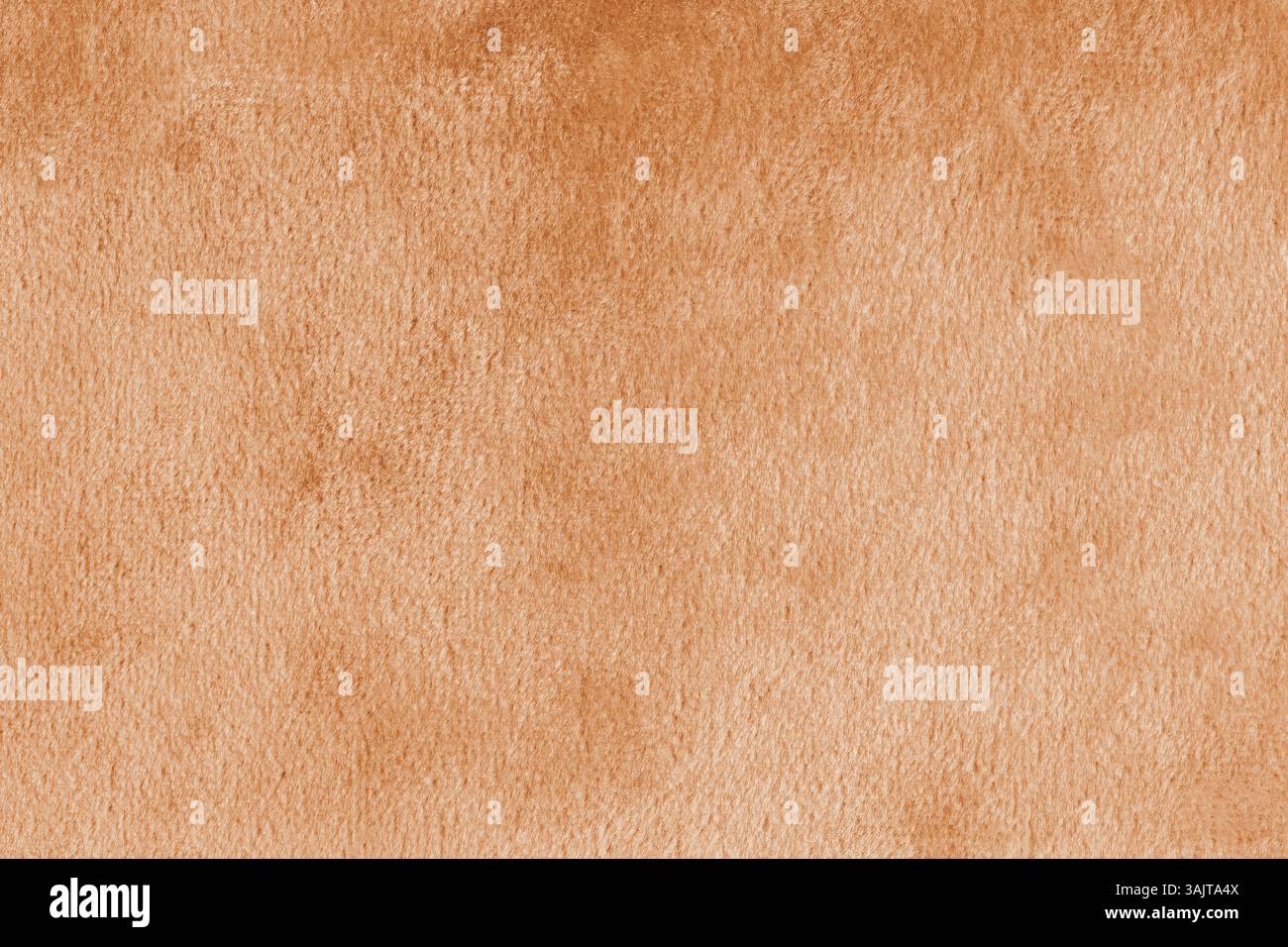 Kunstfell, glänzender Seidensamtstoff in Orange oder Stoffmakro, Nahaufnahme. Die flauschige Gewebeschicht aus Kunstpelztextilien. Hintergrund der Arbeitsfläche. Einrichtung Stockfoto