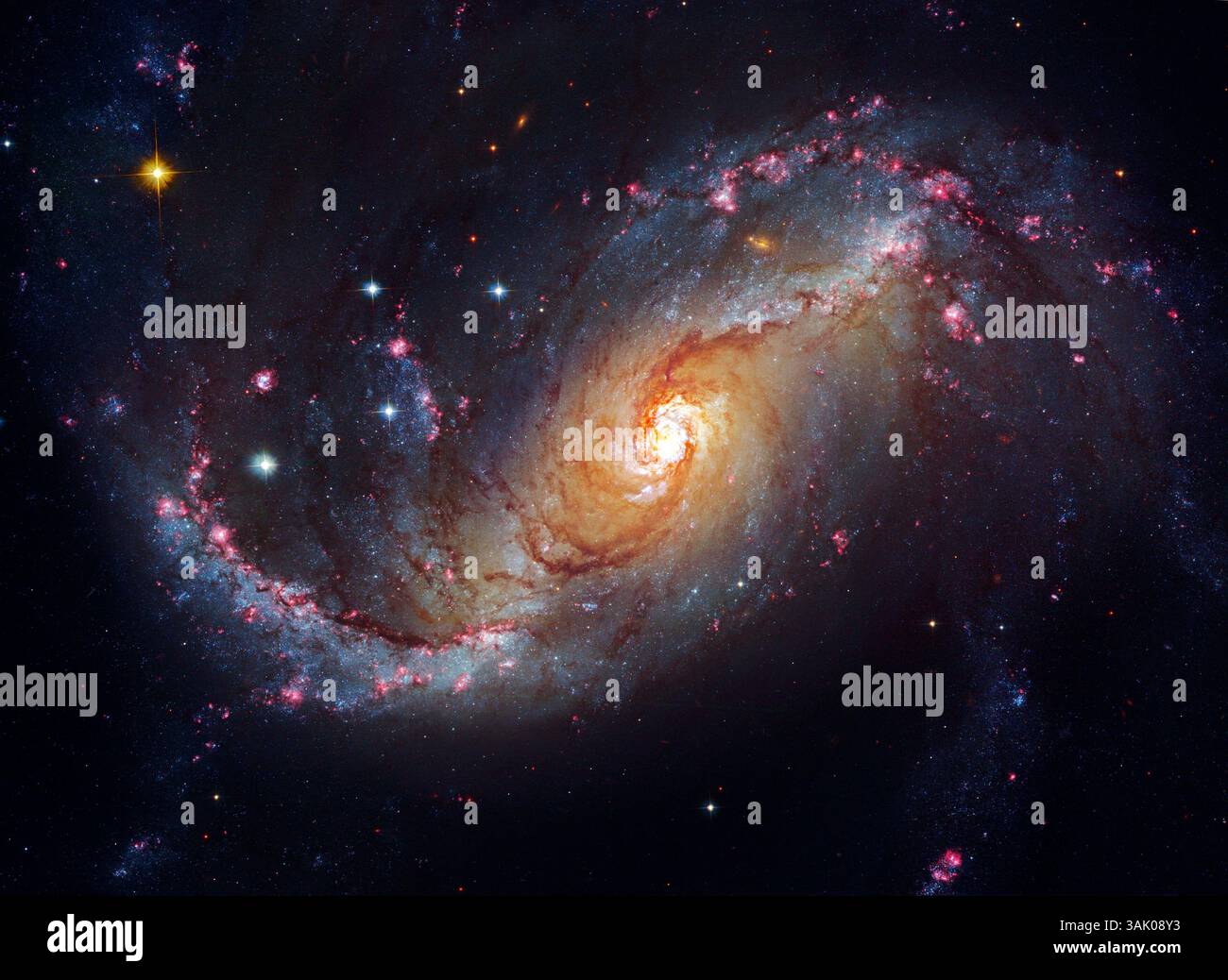 Spiralgalaxie NGC 1672, Hubble-Weltraumteleskop-Bild. NGC 1672 liegt über 60 Millionen Lichtjahre von der Erde entfernt im Sternbild Dorado. Dieses Bild zeigt Details in den sternbildenden Wolken der Galaxie, einschließlich dunkler Banden von interstellarem Staub. Stockfoto