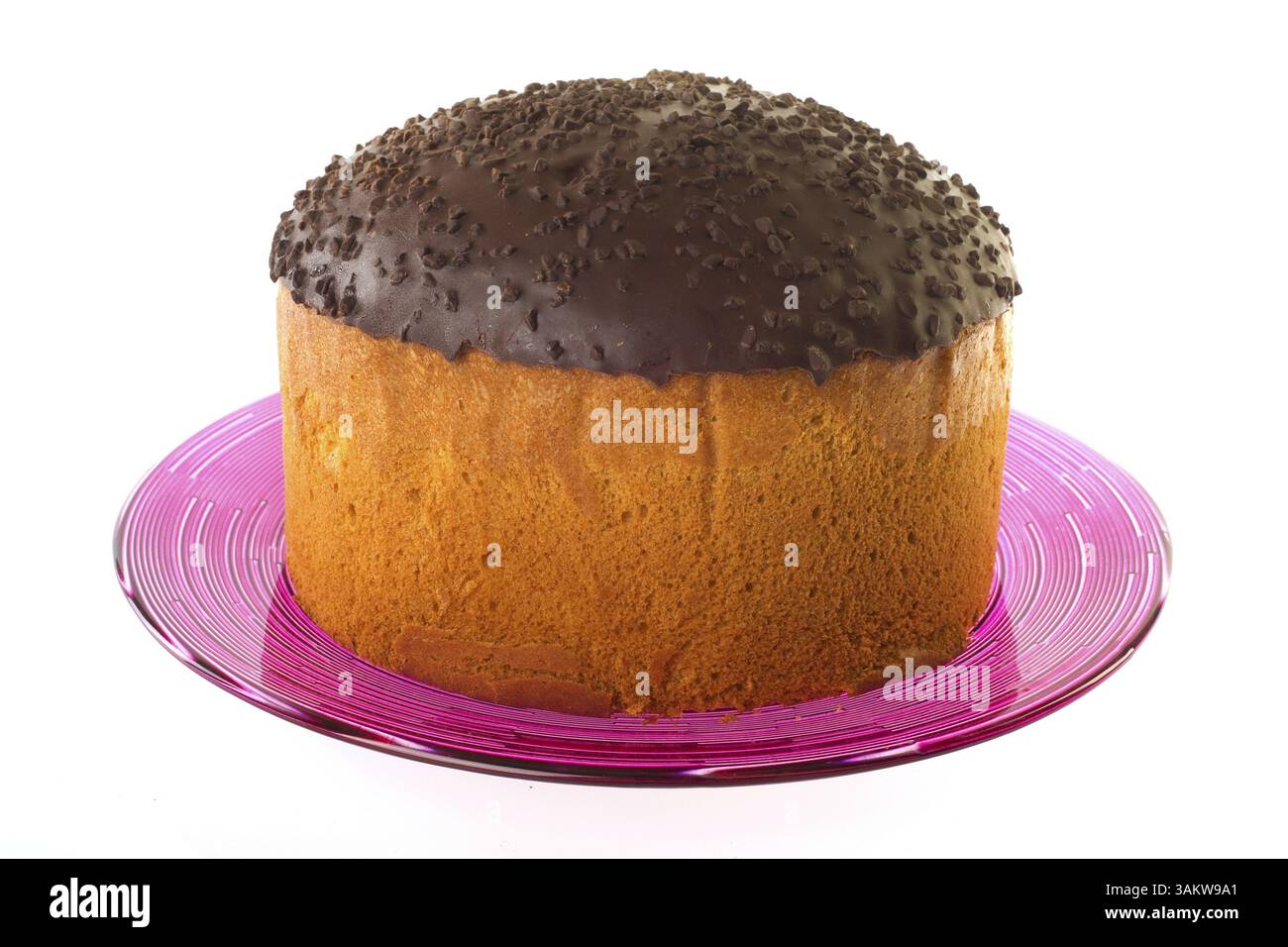 Süße Kuchen mit Schokoladenglasur auf rosa Glasplatte Stockfoto