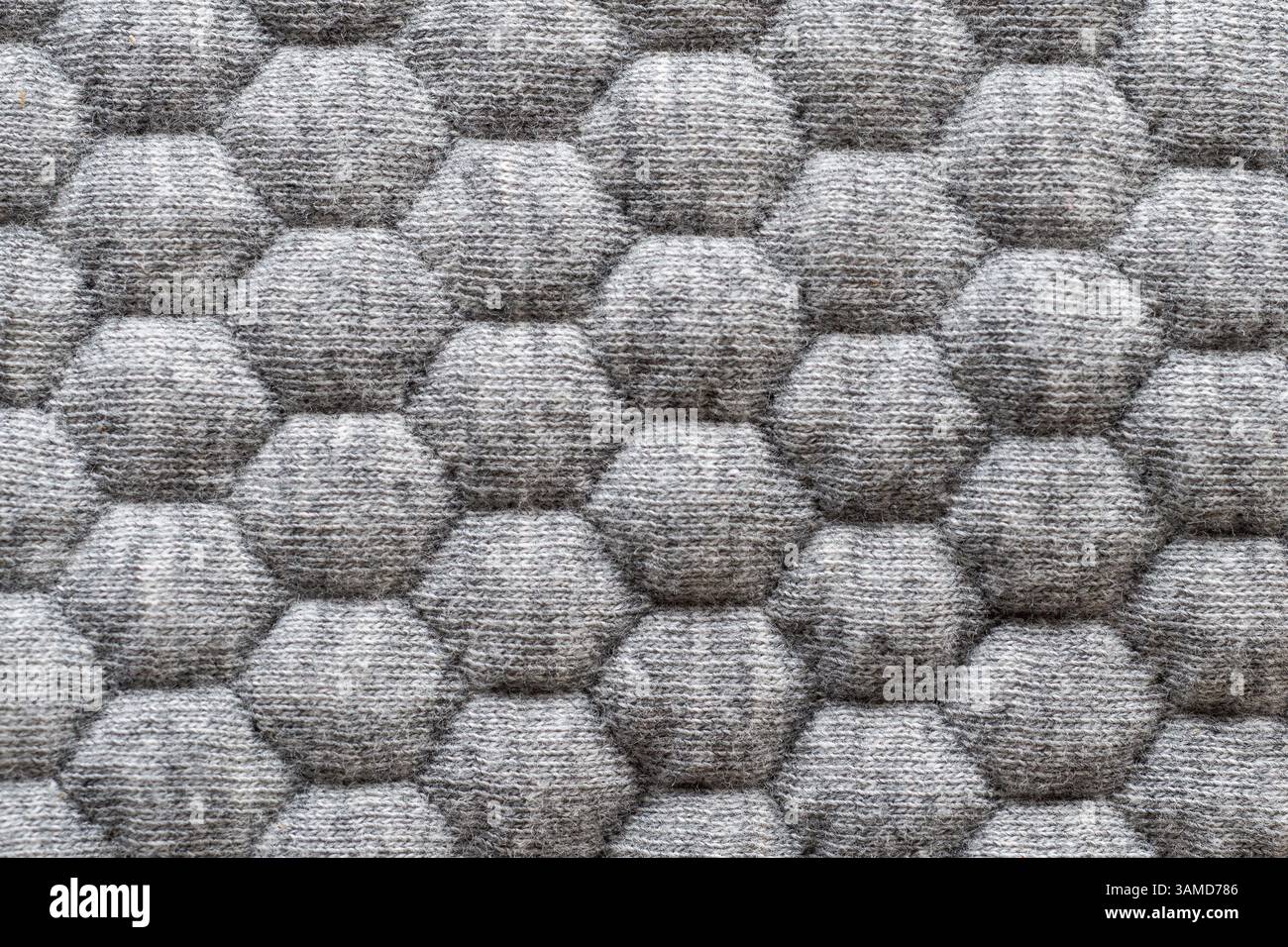 Nahtloses, sich wiederholendes sechseckiges Muster auf weichem Textilmaterial Stockfoto