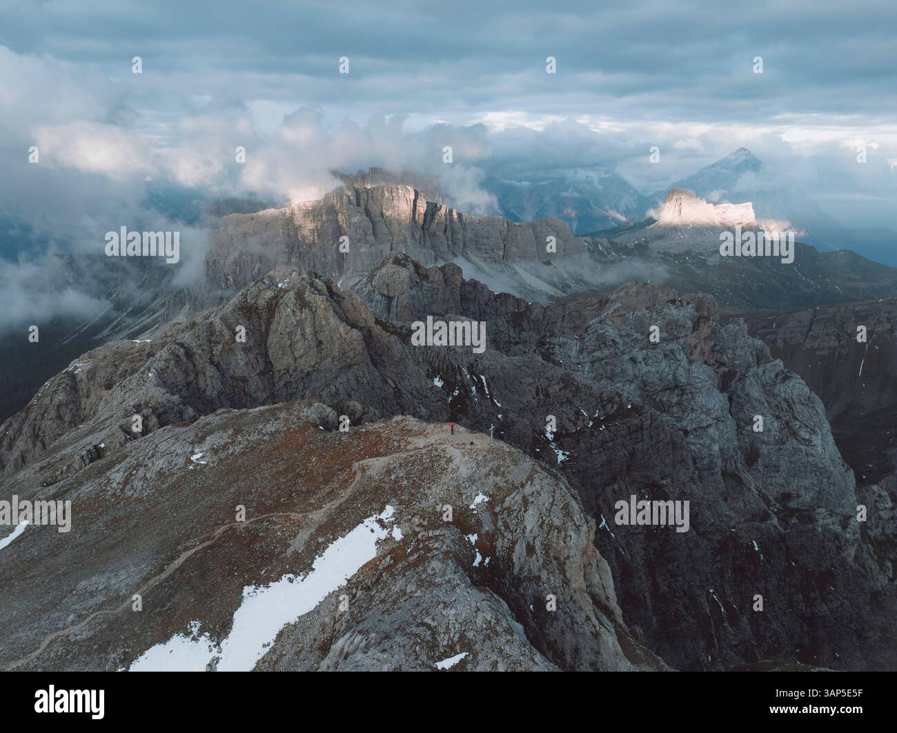 Aerial view of majestic rocky mountains under dramatic cloudy sky, Selva di Cadore, Italy. Stockfoto