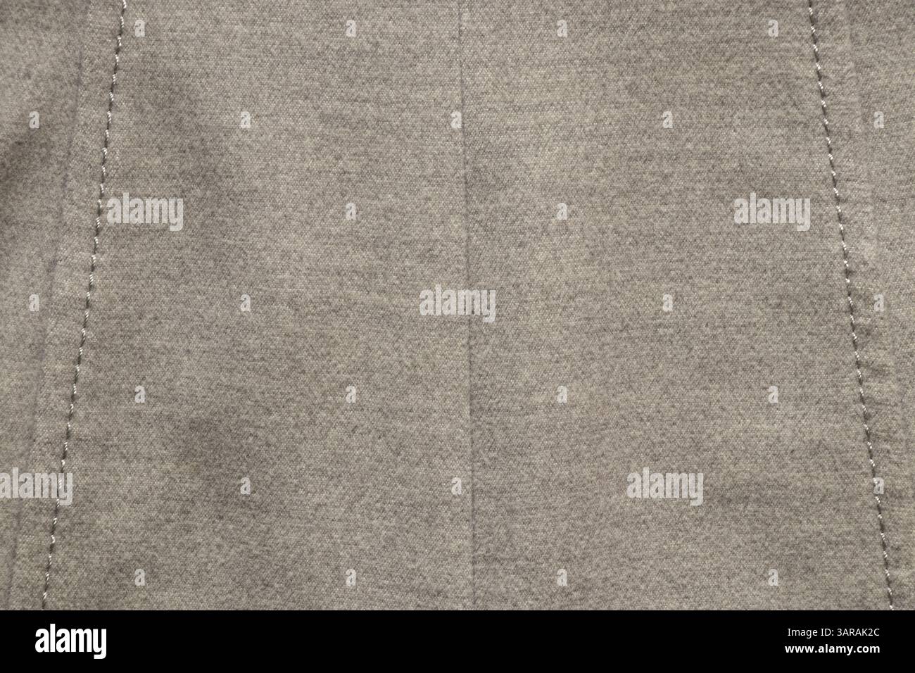 Graue Damenwolle Herbstmantel als Hintergrund Nahaufnahme, Mode Kleidung, grauer Stoff Stockfoto