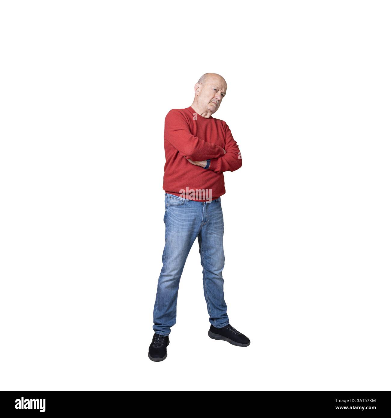 Ein aufmerksamer Mann mit gefalteten Armen Stockfoto