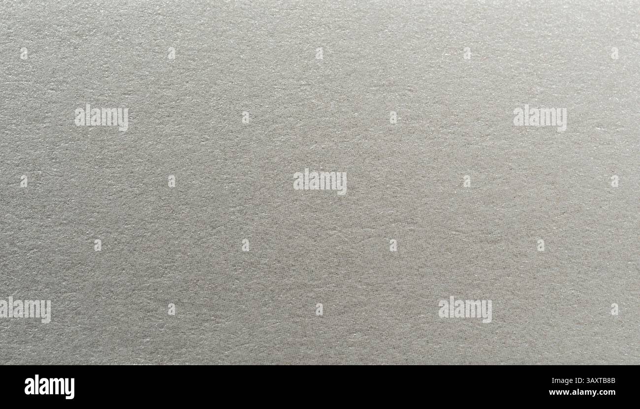 Hellgraues Papier mit einer glatten, dezenten Textur, die seine minimalistische Ästhetik und sein elegantes Design unterstreicht. Stockfoto