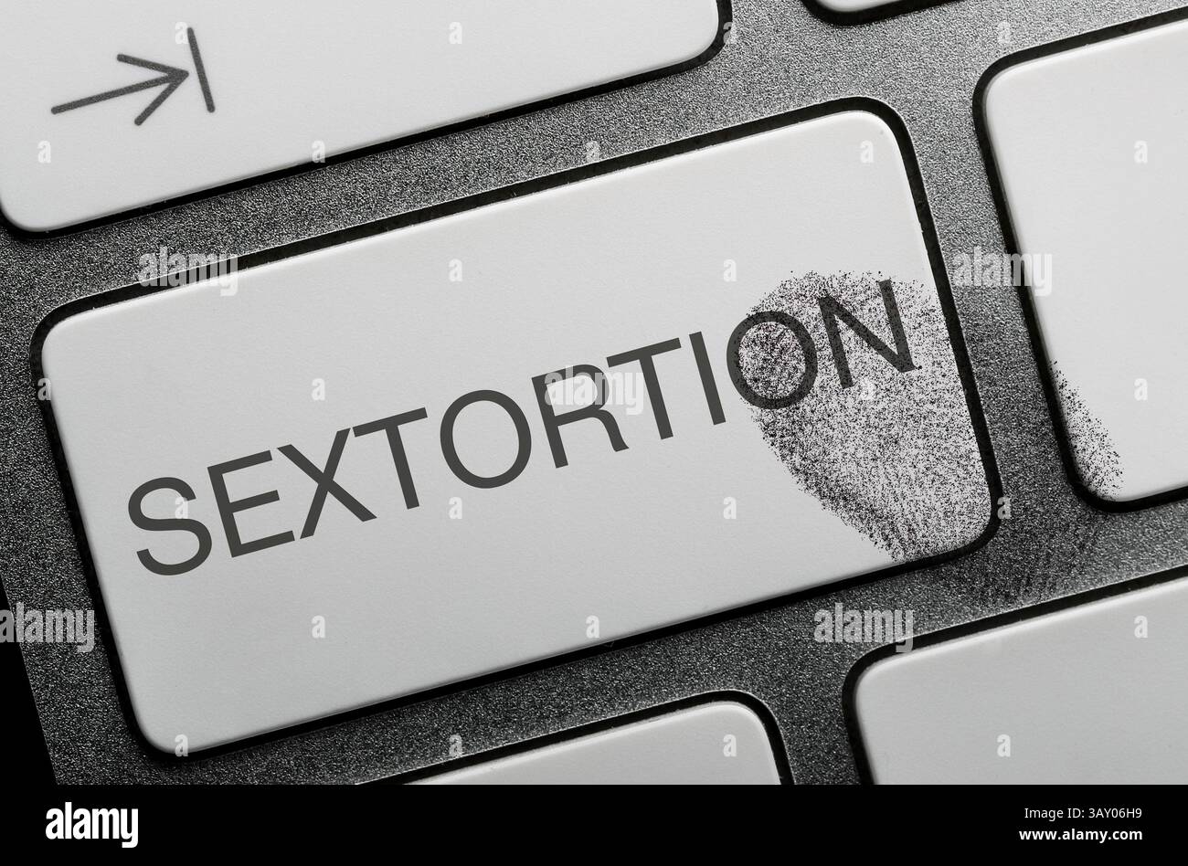 Sextortion auf einer Computertastatur. Stockfoto