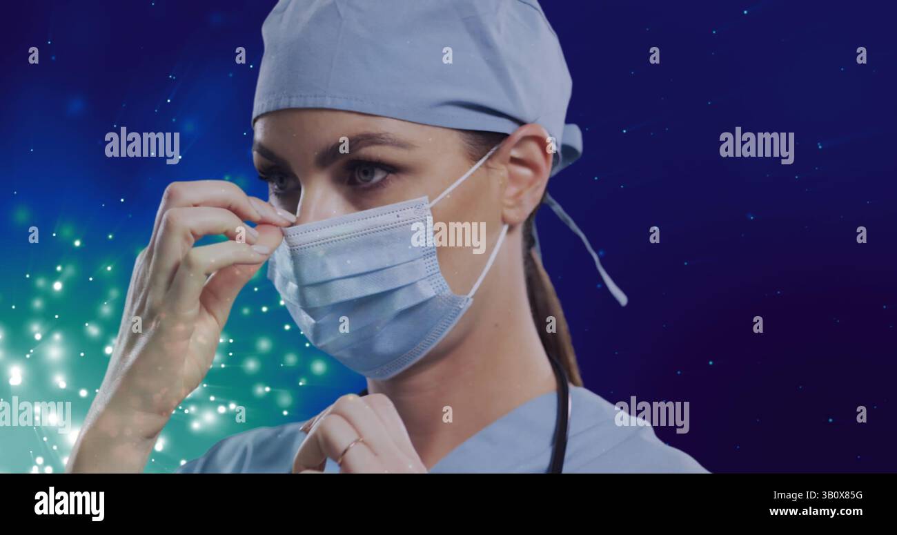 Bild einer kaukasischen Ärztin über hellen Flecken auf blauem Hintergrund Stockfoto