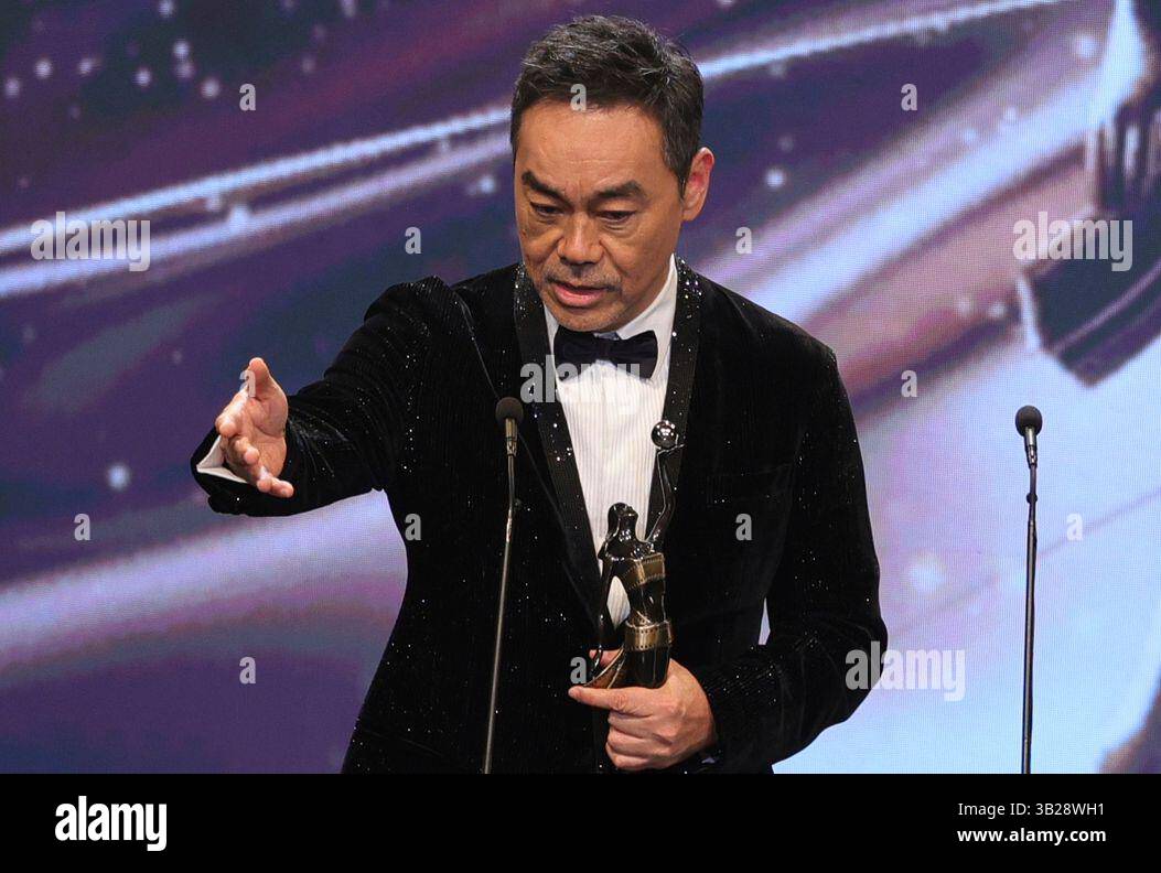 Sean Lau reacts after receiving the Best Actor award for the film "Papa" at the 43rd Hong Kong Film Awards at the Hong Kong Culture Center on Sunday, April 27, 2025. (AP Photo/May James) Stockfoto