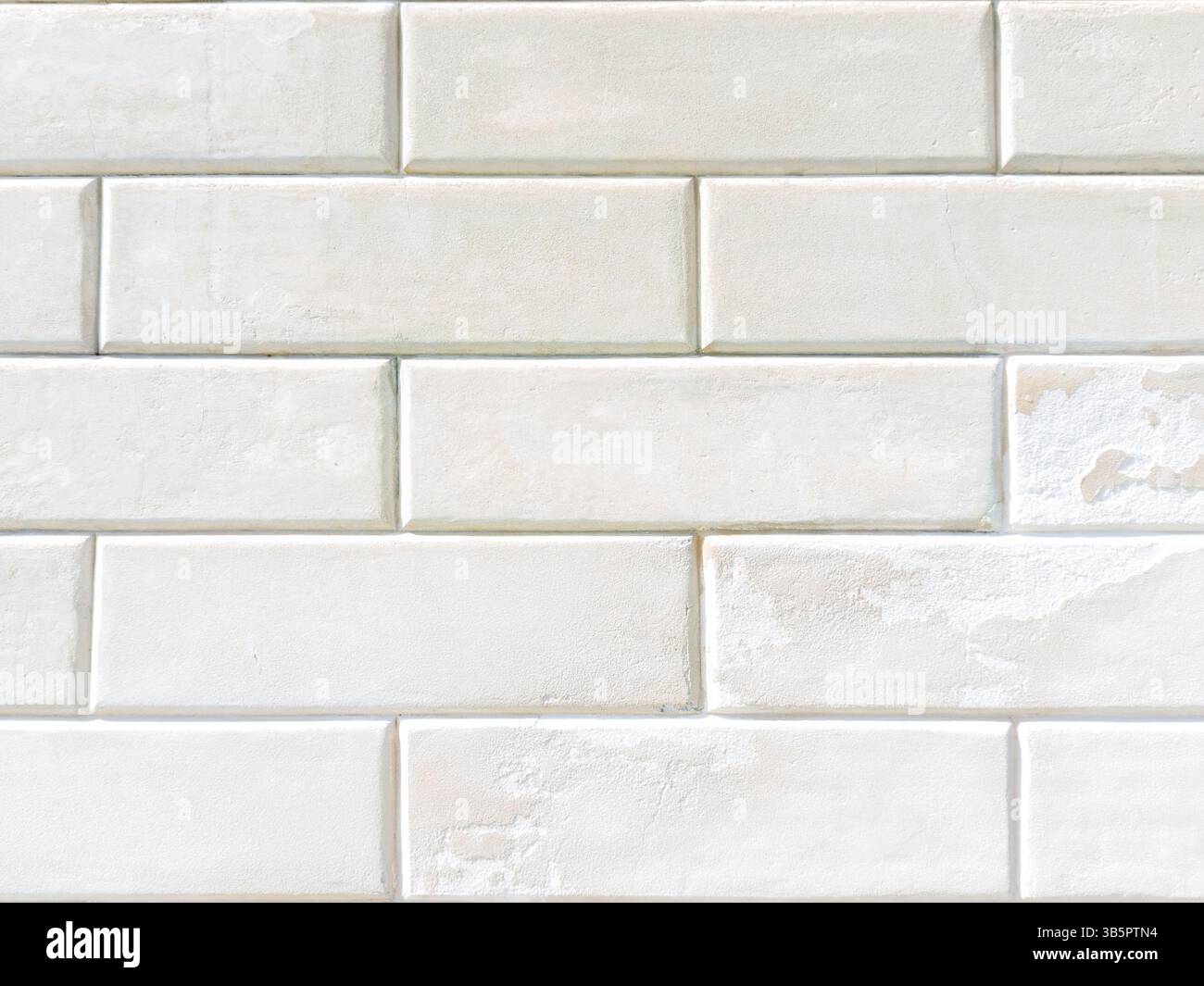 Alte weiße Steinmauer mit rechteckigem Muster Stockfoto