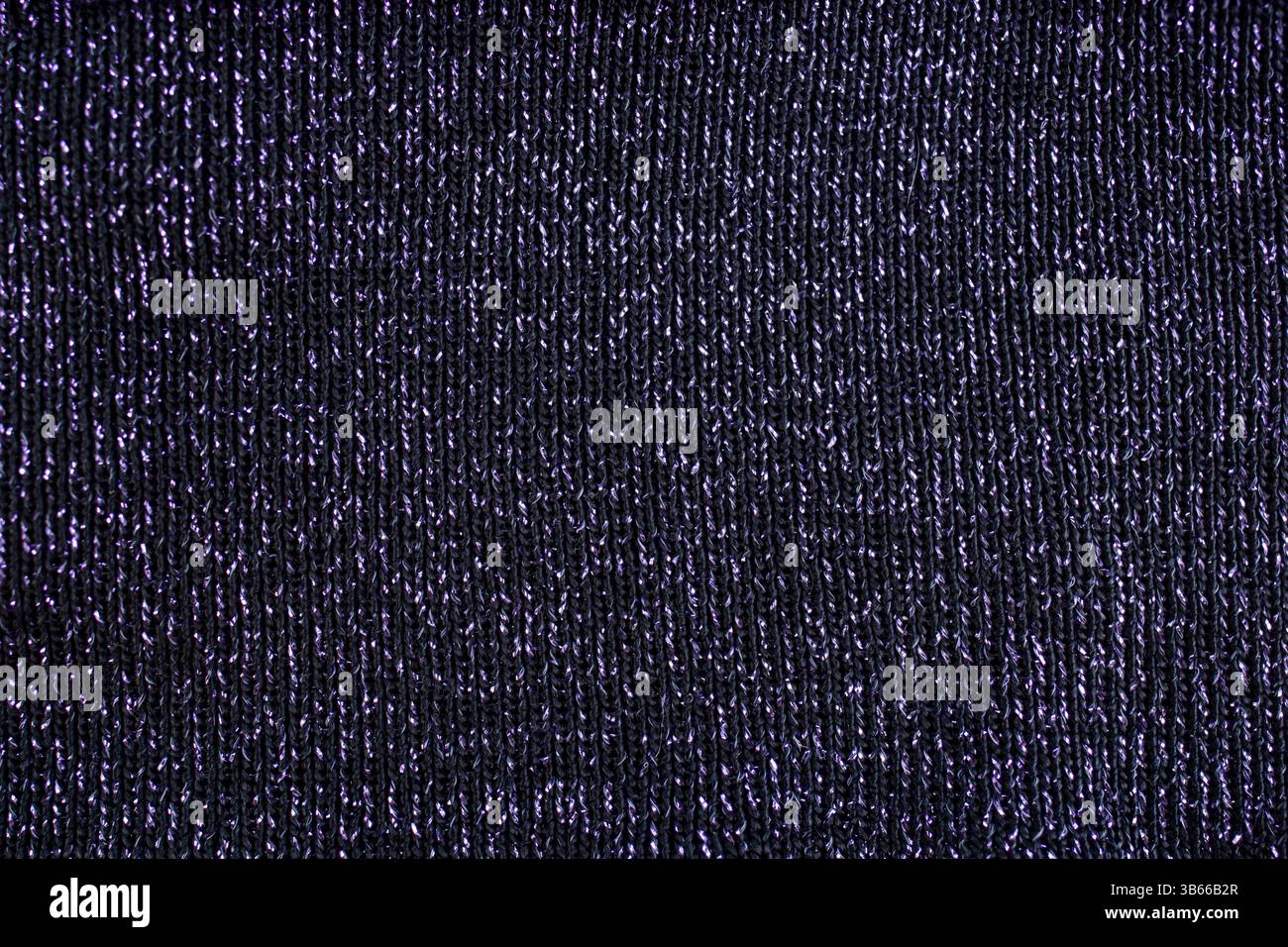 Schwarzes Gewebe mit silbernem Metallic-Garn, abstrakter Hintergrund Stockfoto